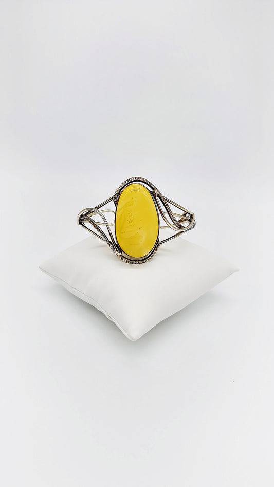 Silver bangle with honey-colored amber