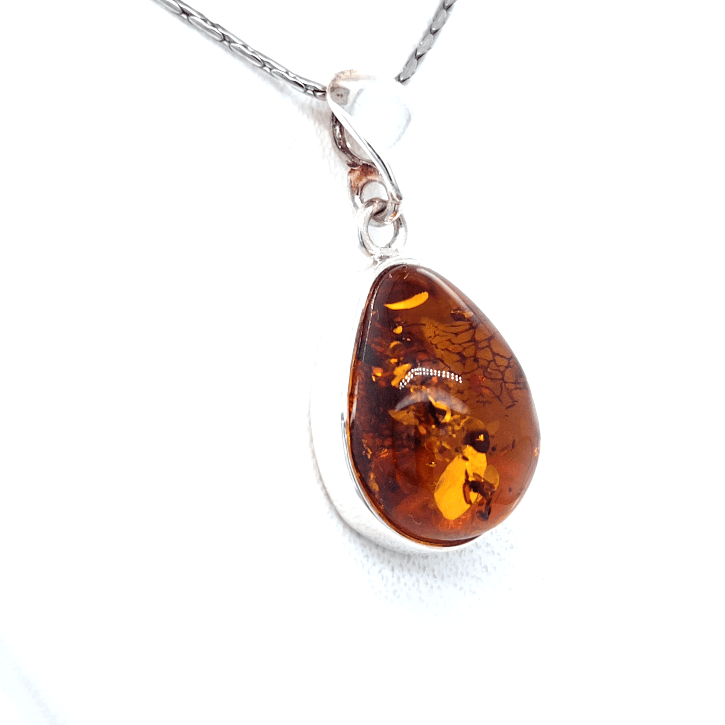 Elegant Silver Pendant with Baltic Amber