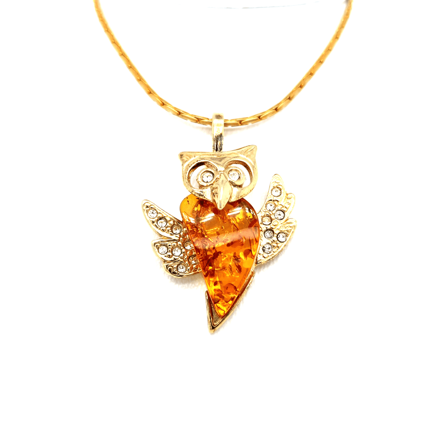 Wisdom and splendor: Gold-plated owl pendant with amber