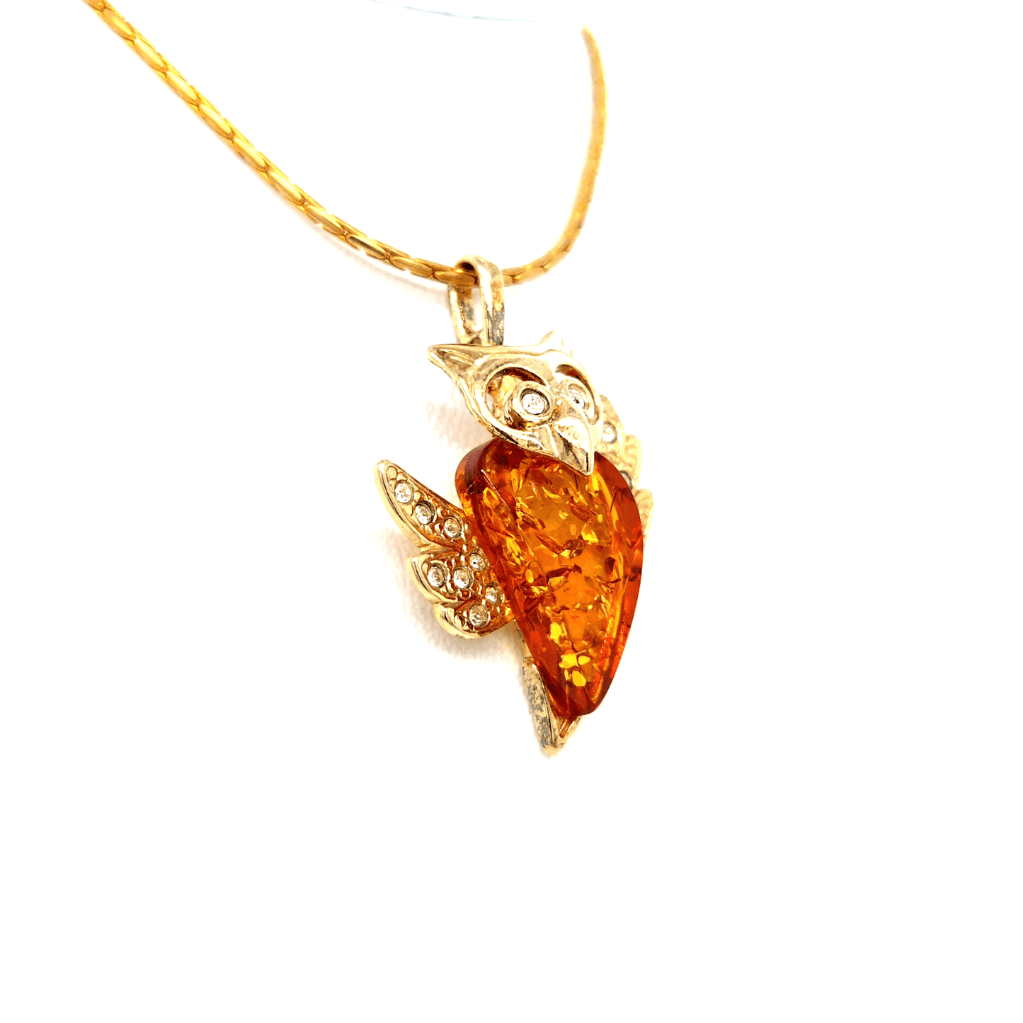 Wisdom and splendor: Gold-plated owl pendant with amber