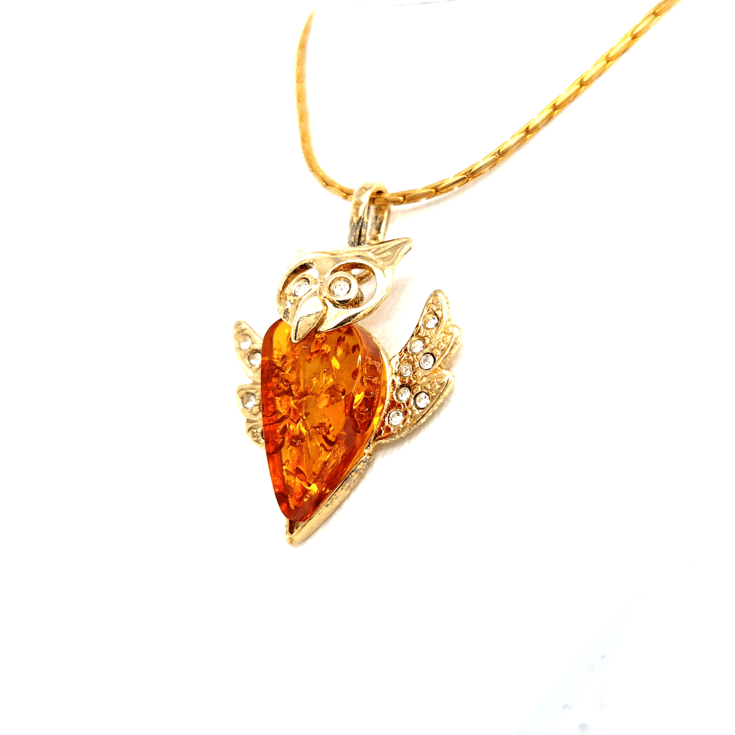 Wisdom and splendor: Gold-plated owl pendant with amber