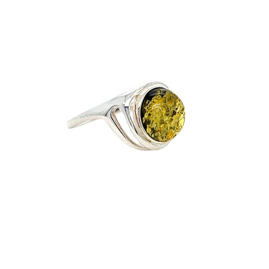 Elegant silver ring with genuine green amber