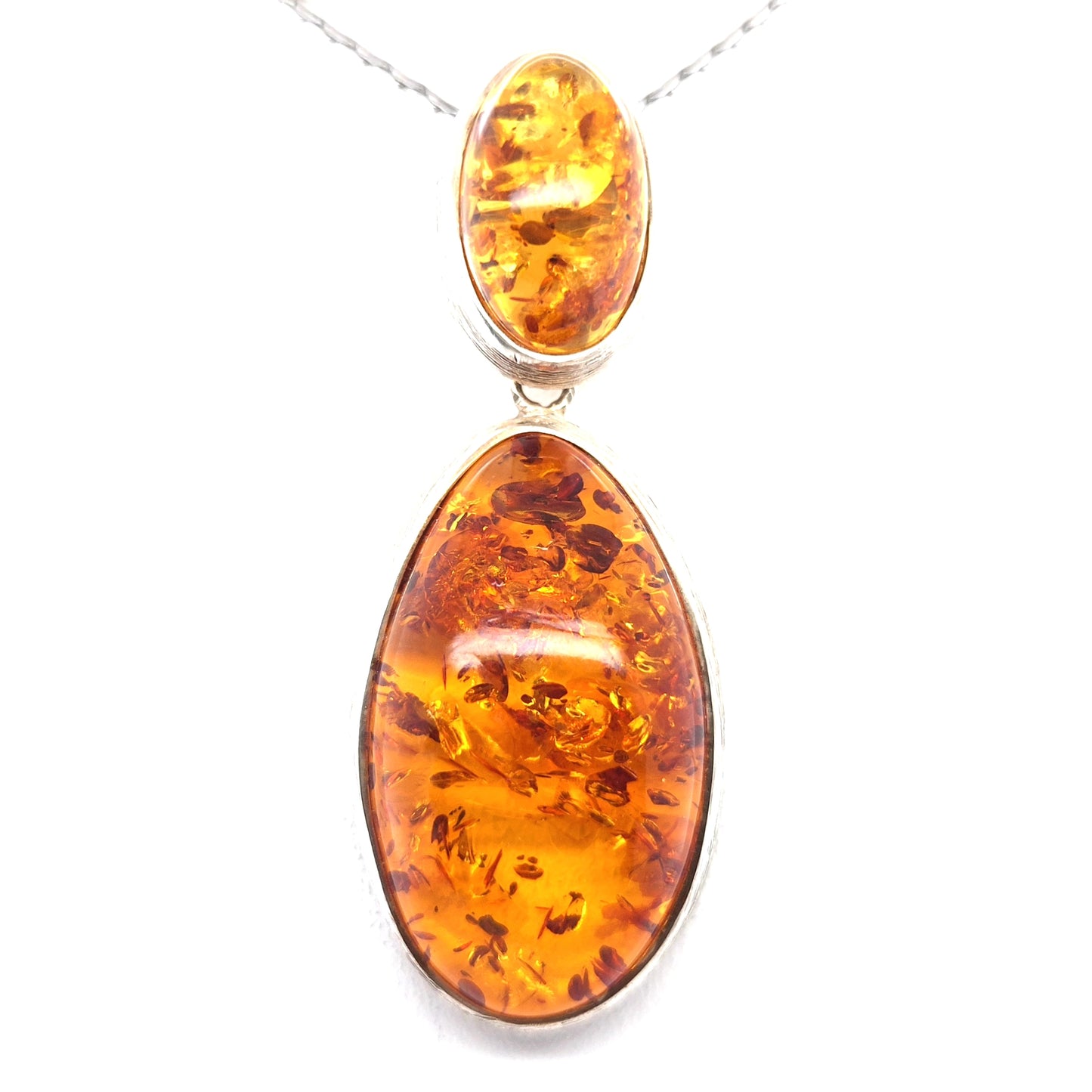 Long amber pendant in vintage style made of silver