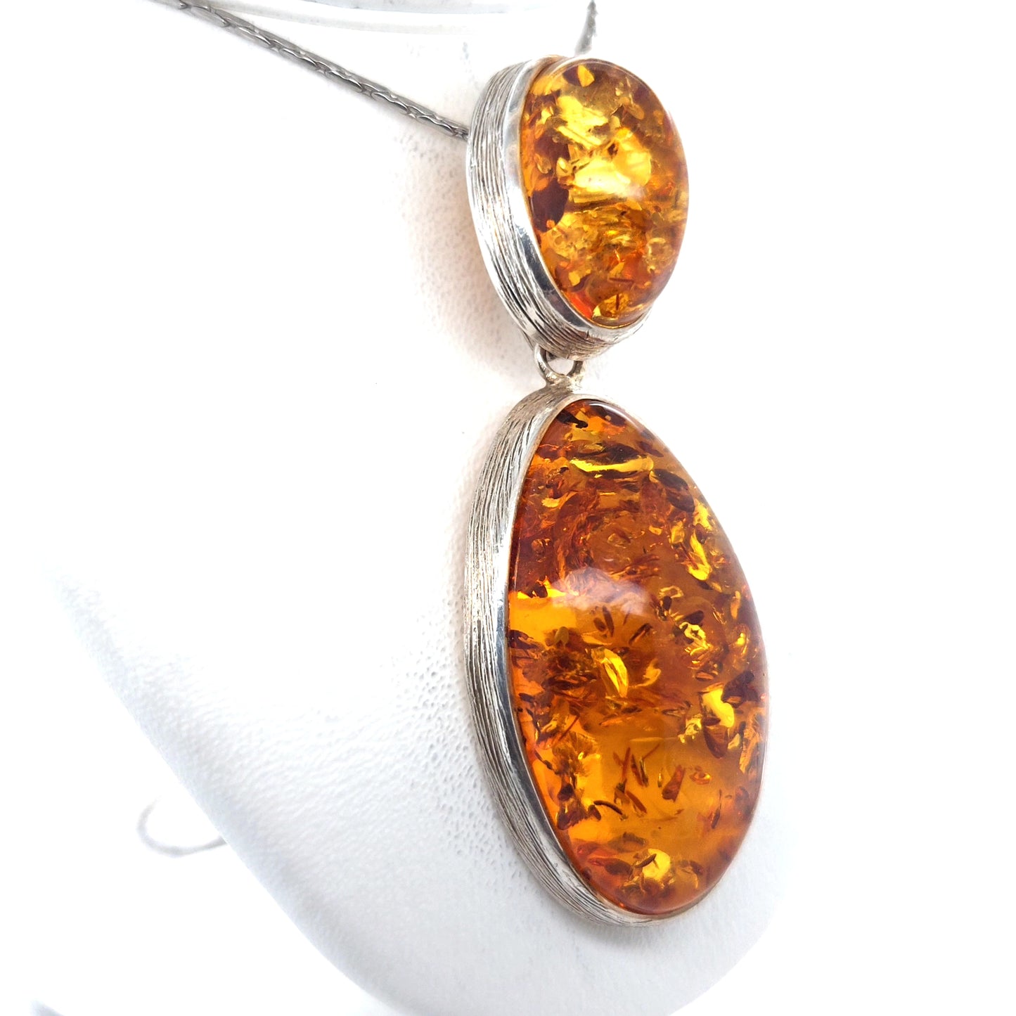 Long amber pendant in vintage style made of silver