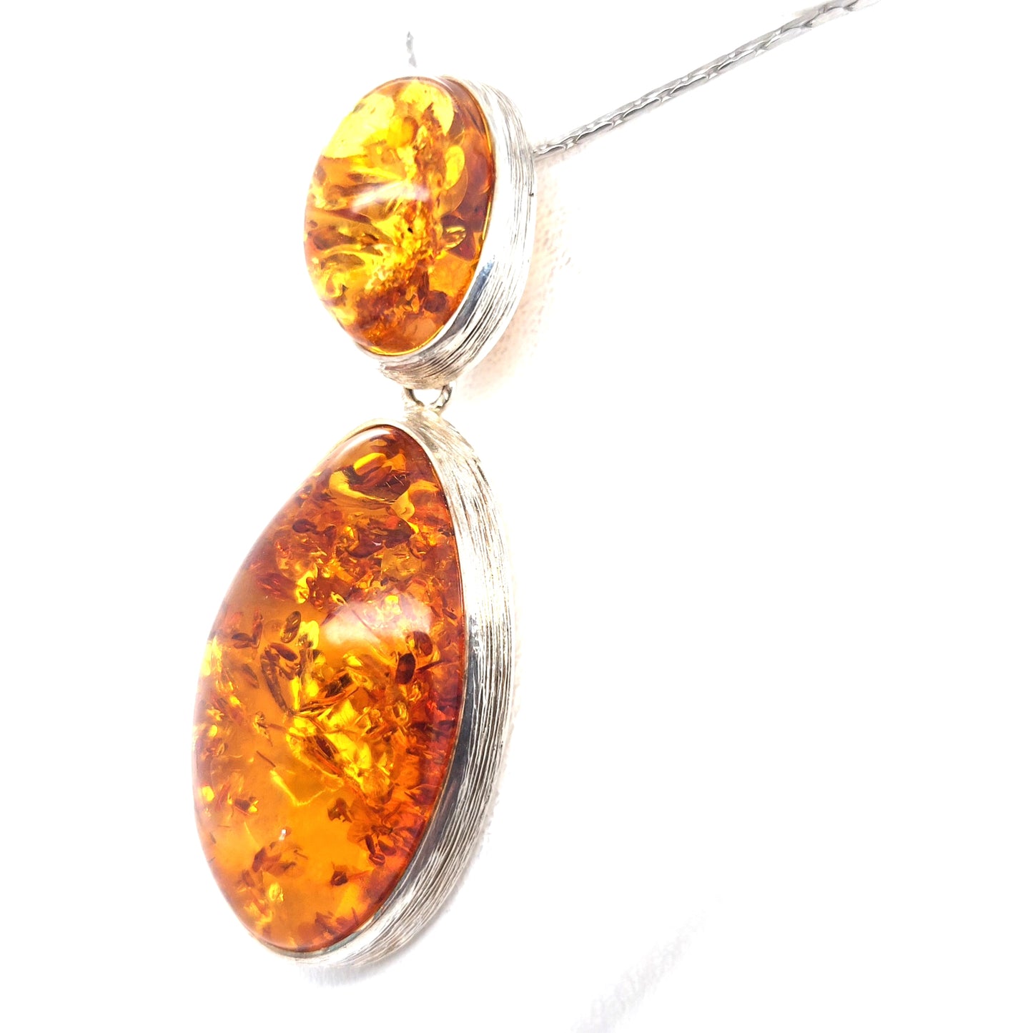 Long amber pendant in vintage style made of silver