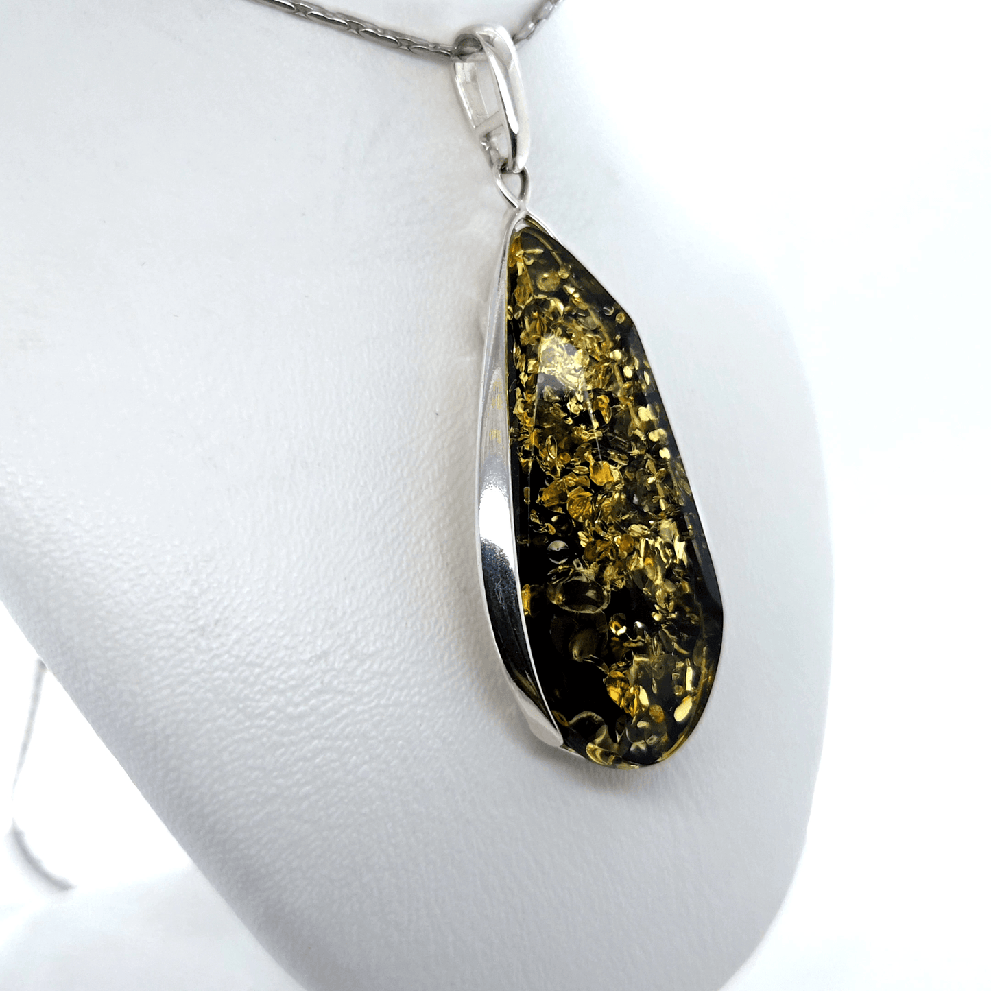 Teardrop pendant with green amber