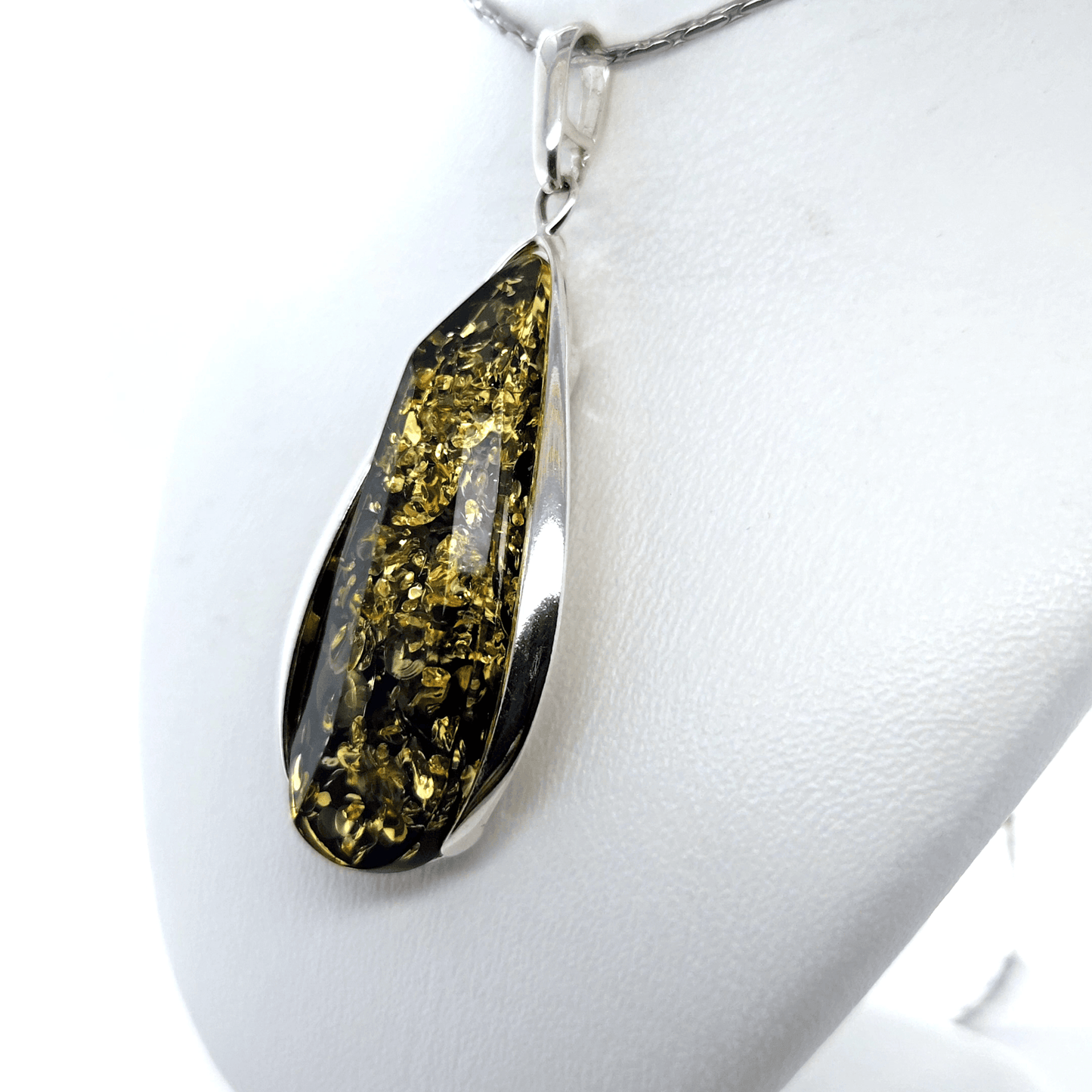 Teardrop pendant with green amber