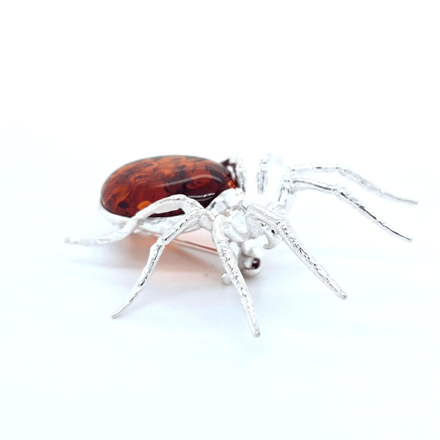 Artistic Spider Brooch in Silver and Amber