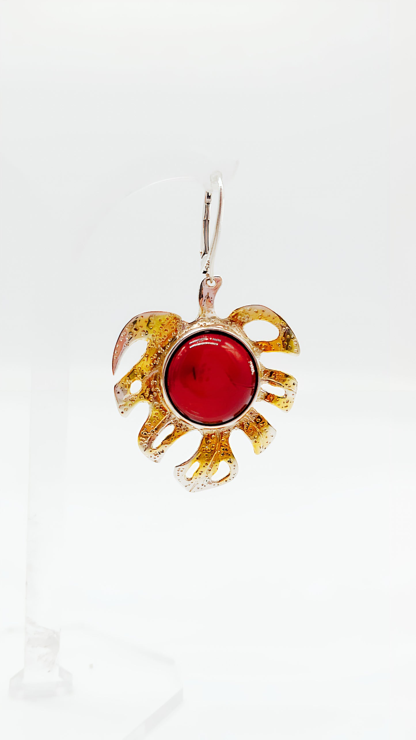 Gold-plated leaf design with bright amber
