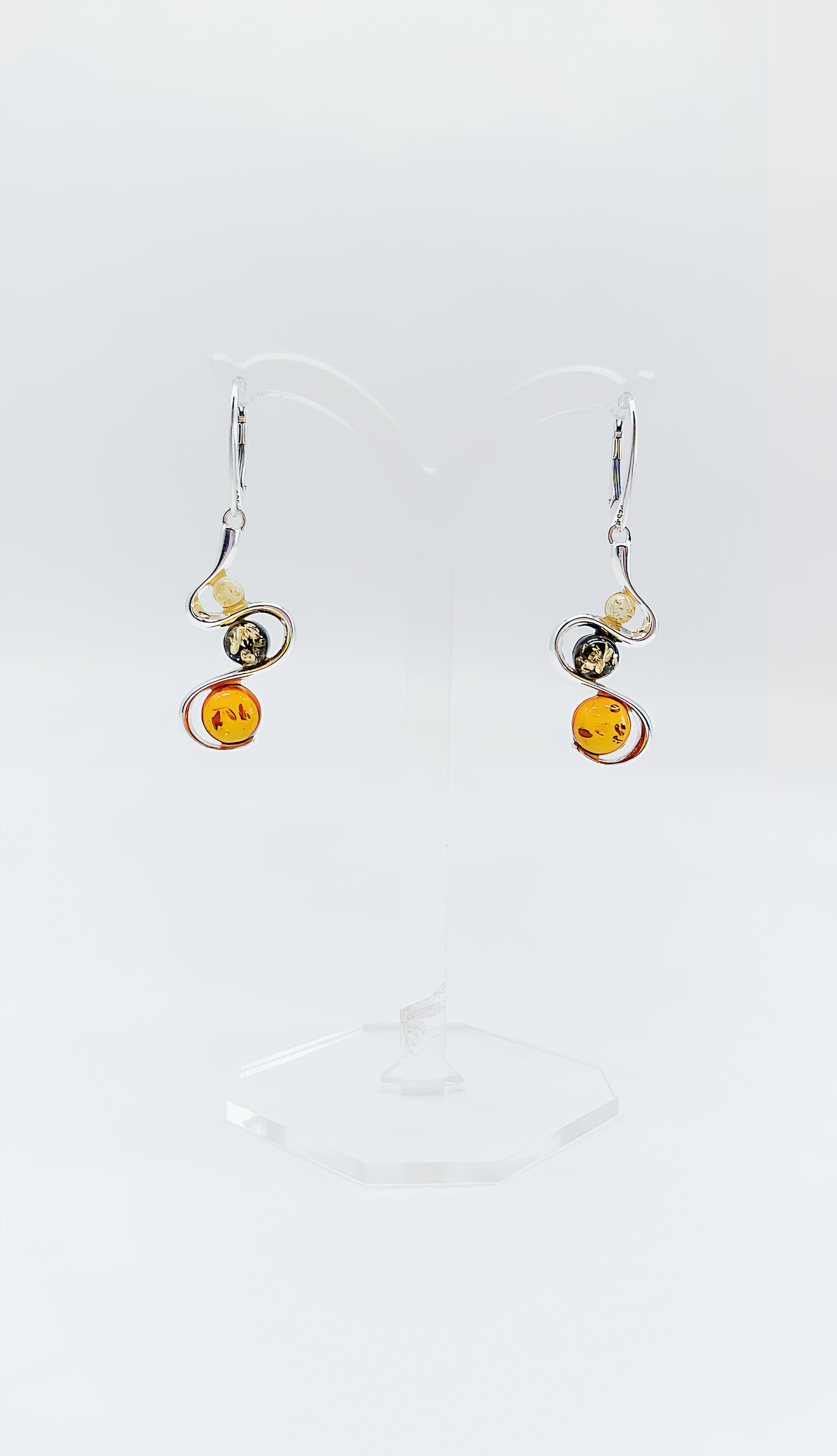 Three colors, one design: earrings with colorful amber