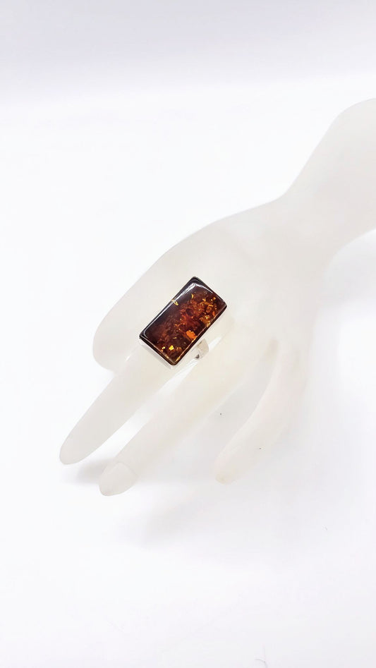 Silver ring with unique amber