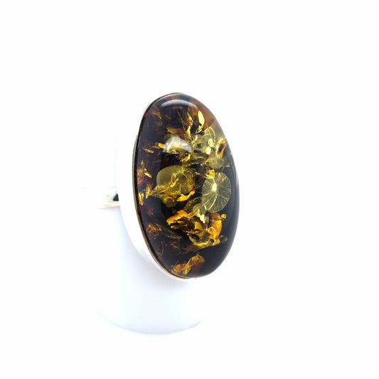 Eleganter Silberring mit grünem Glitzer-Bernstein – oval, offen & verstellbar