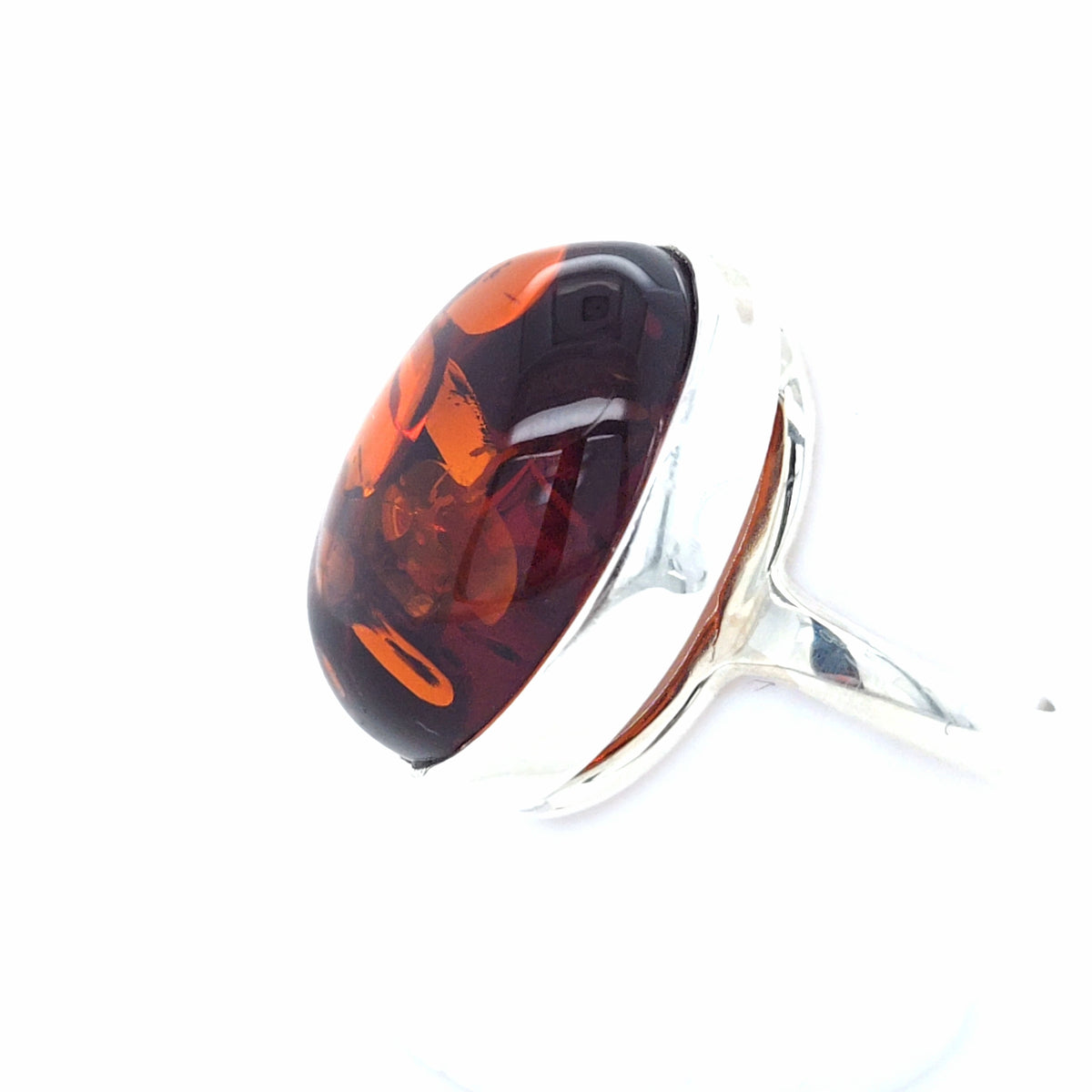 Ausdrucksstarker Bernstein-Ring in Silber – Modernes, offenes Design in leuchtendem Orange