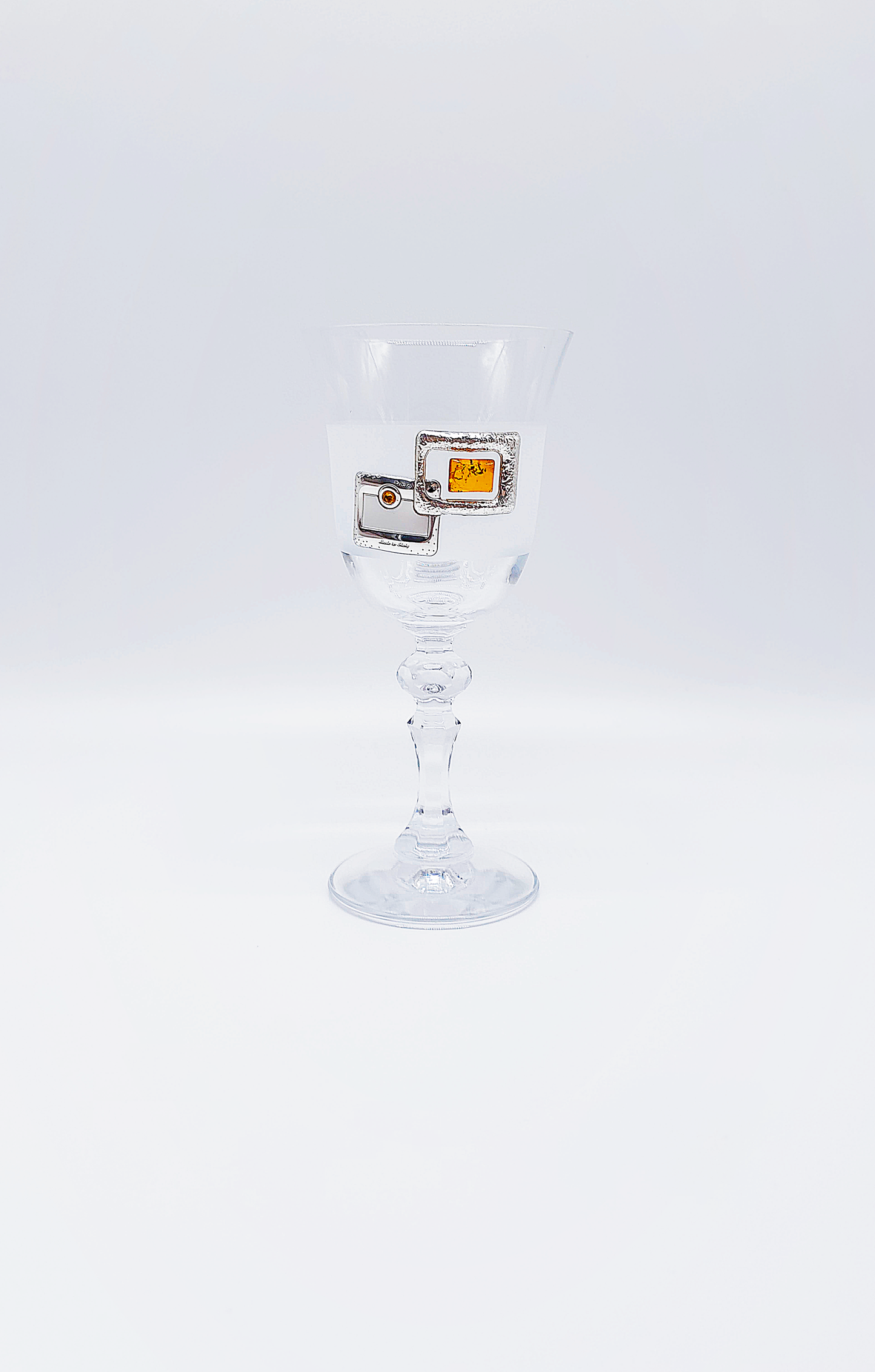 Elegant glass with amber and silver decoration