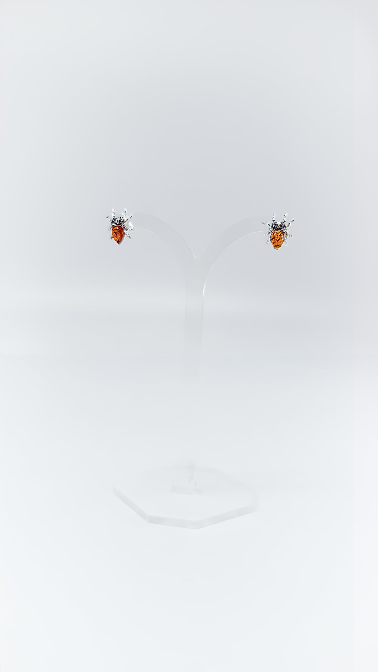 Fascinating spider earrings with amber and silver