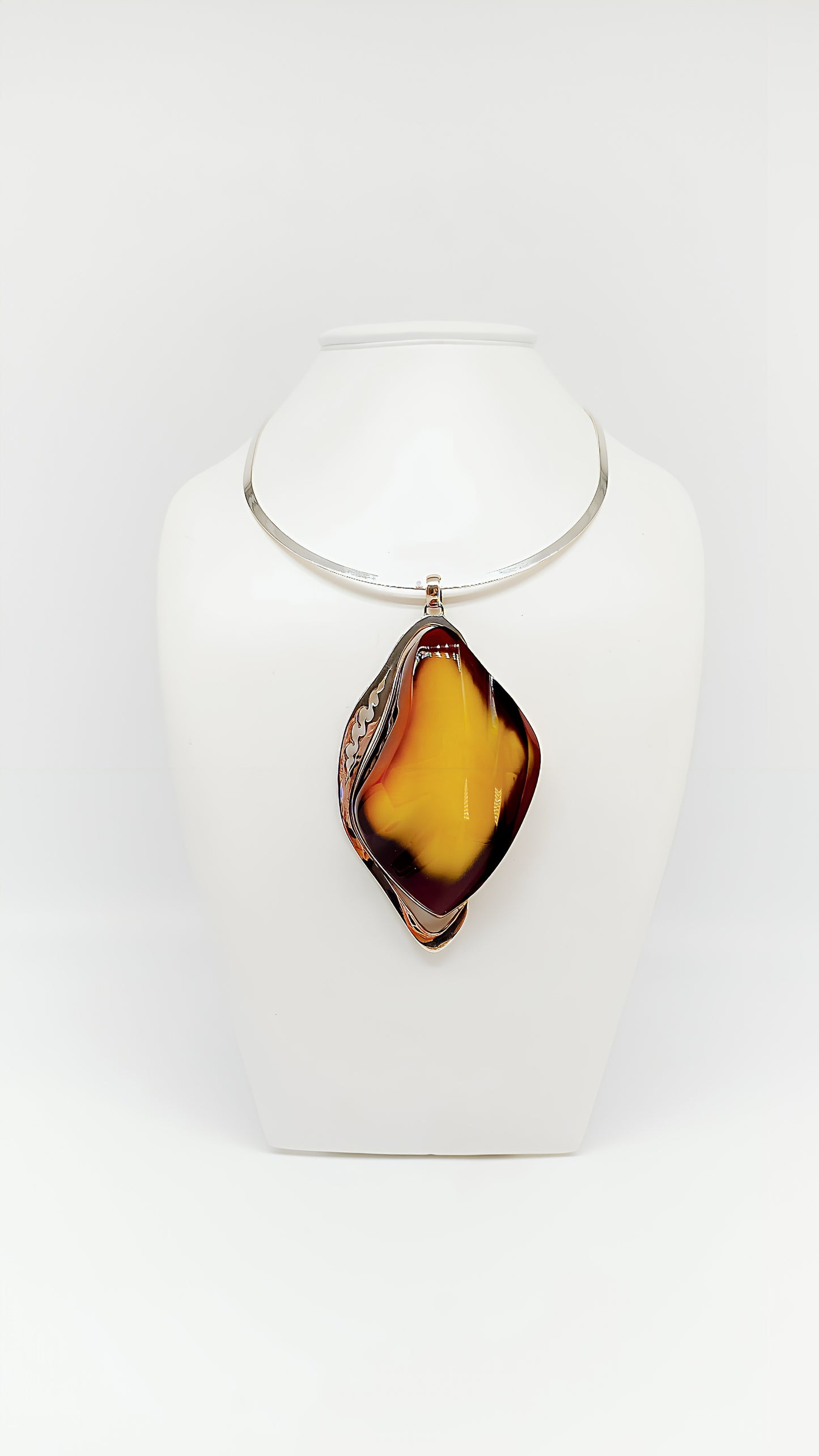 Mystical elegance: unique piece made of amber and silver