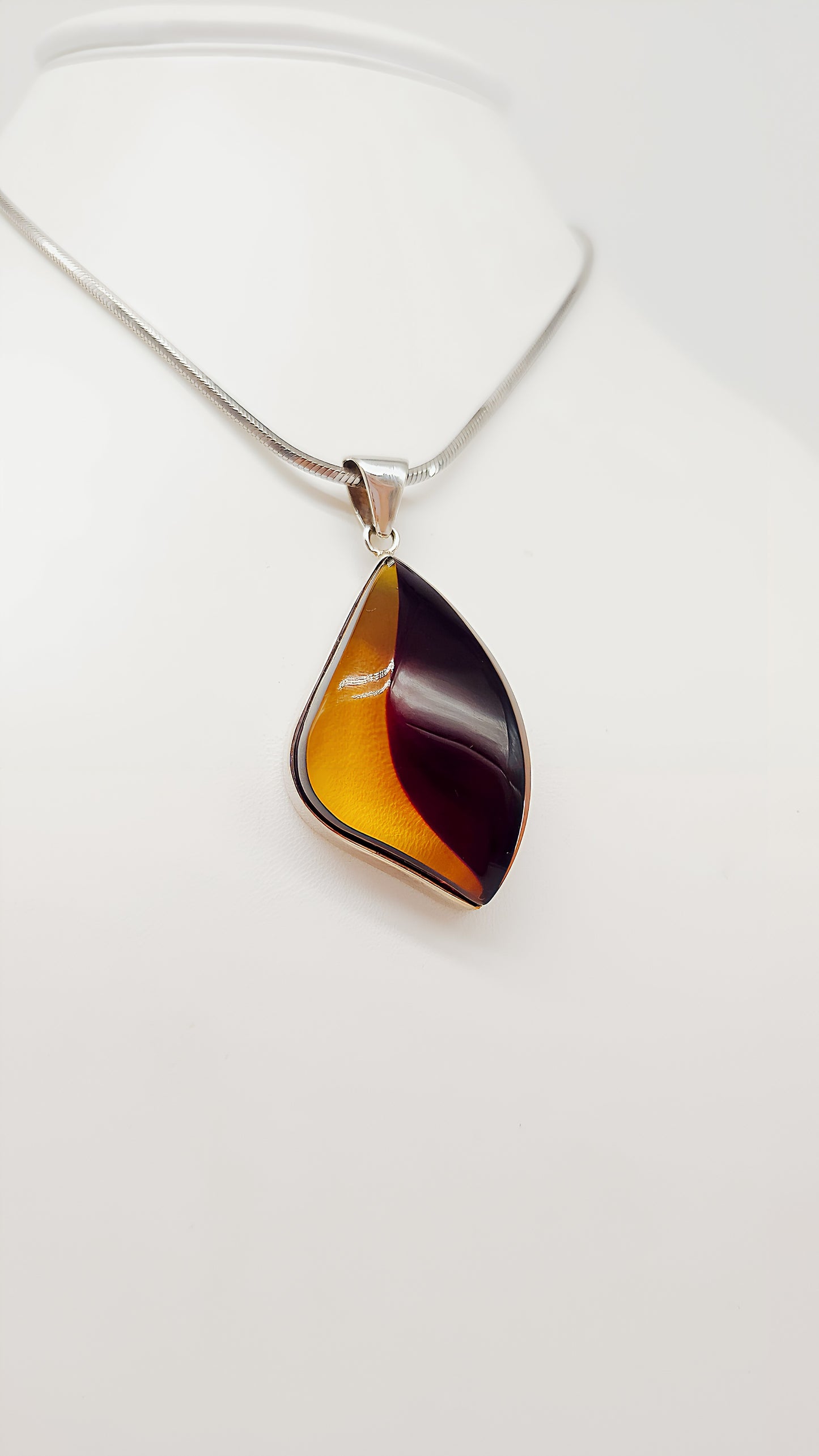 Unique shine: unique amber pendant