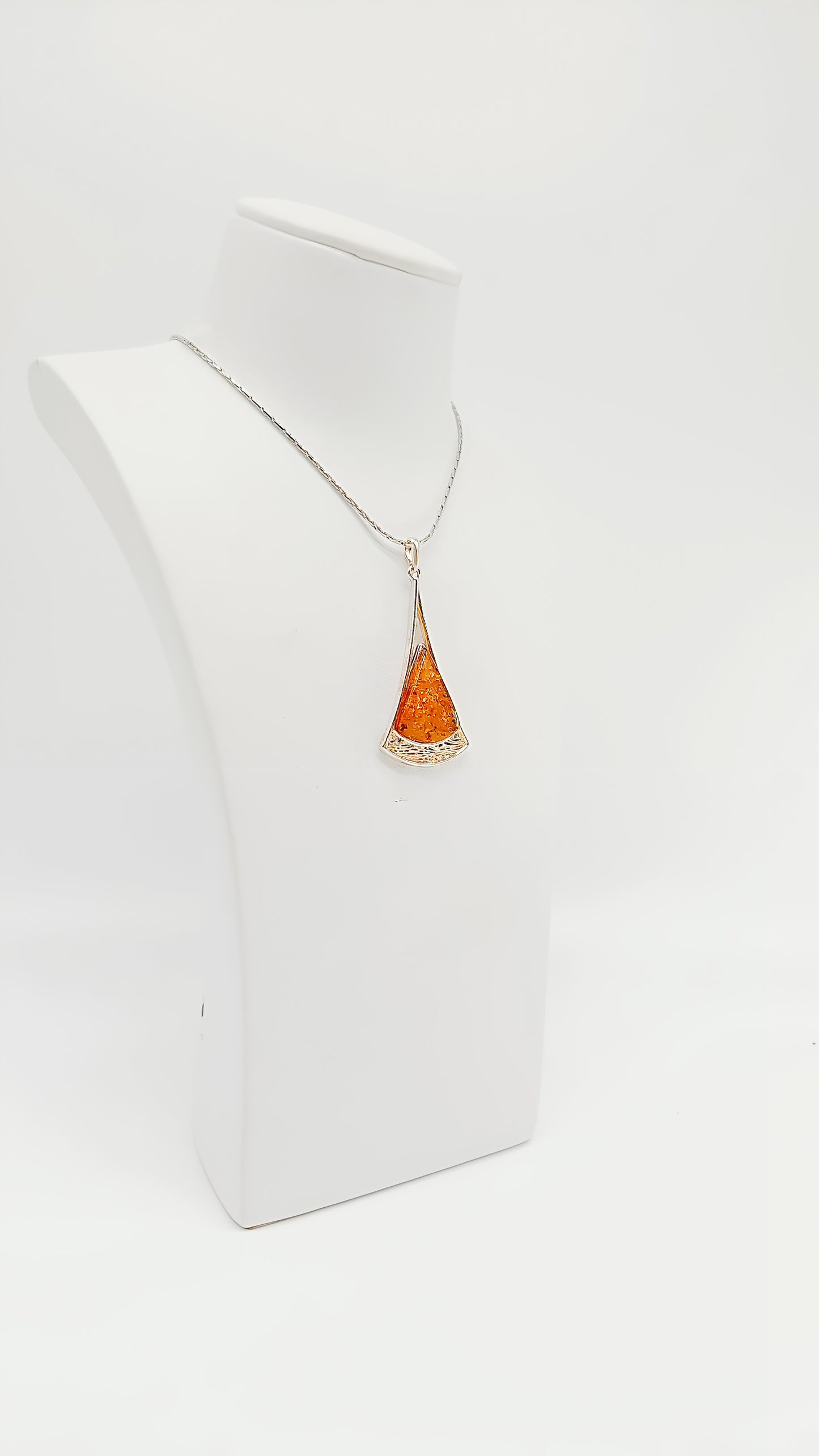 Golden accents: amber pendant in a noble design
