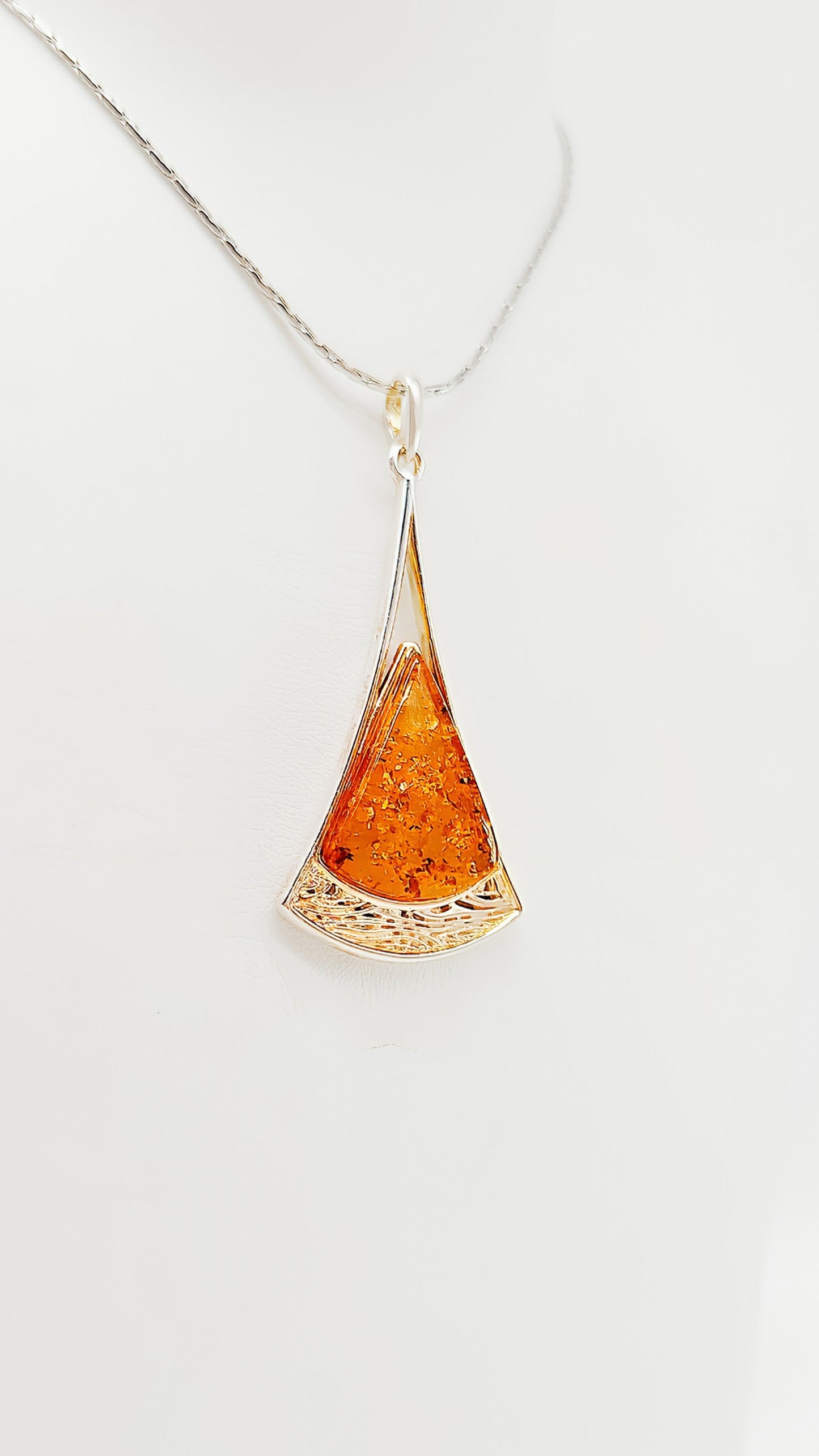 Golden accents: amber pendant in a noble design