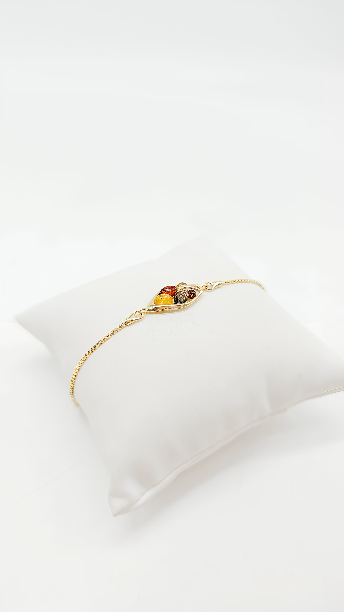 Colorful treasures: amber and gold-plated silver