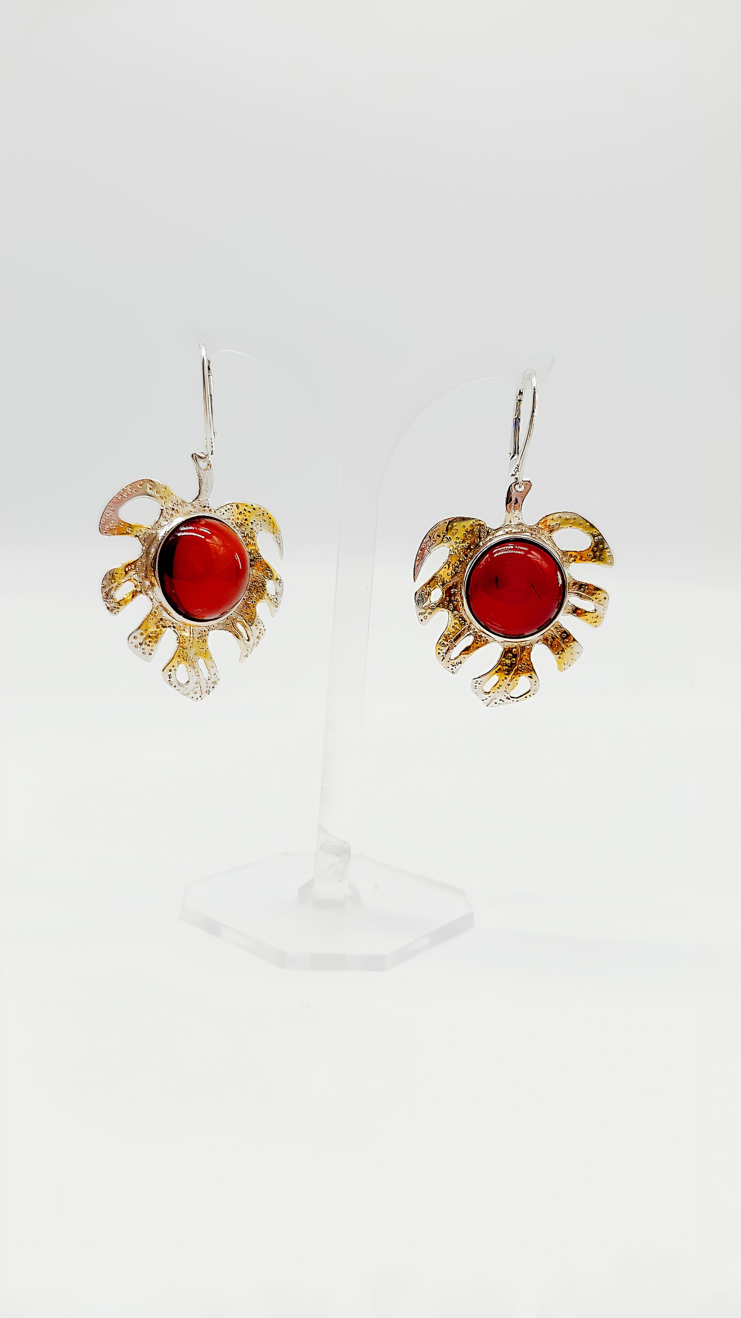 Gold-plated leaf design with bright amber