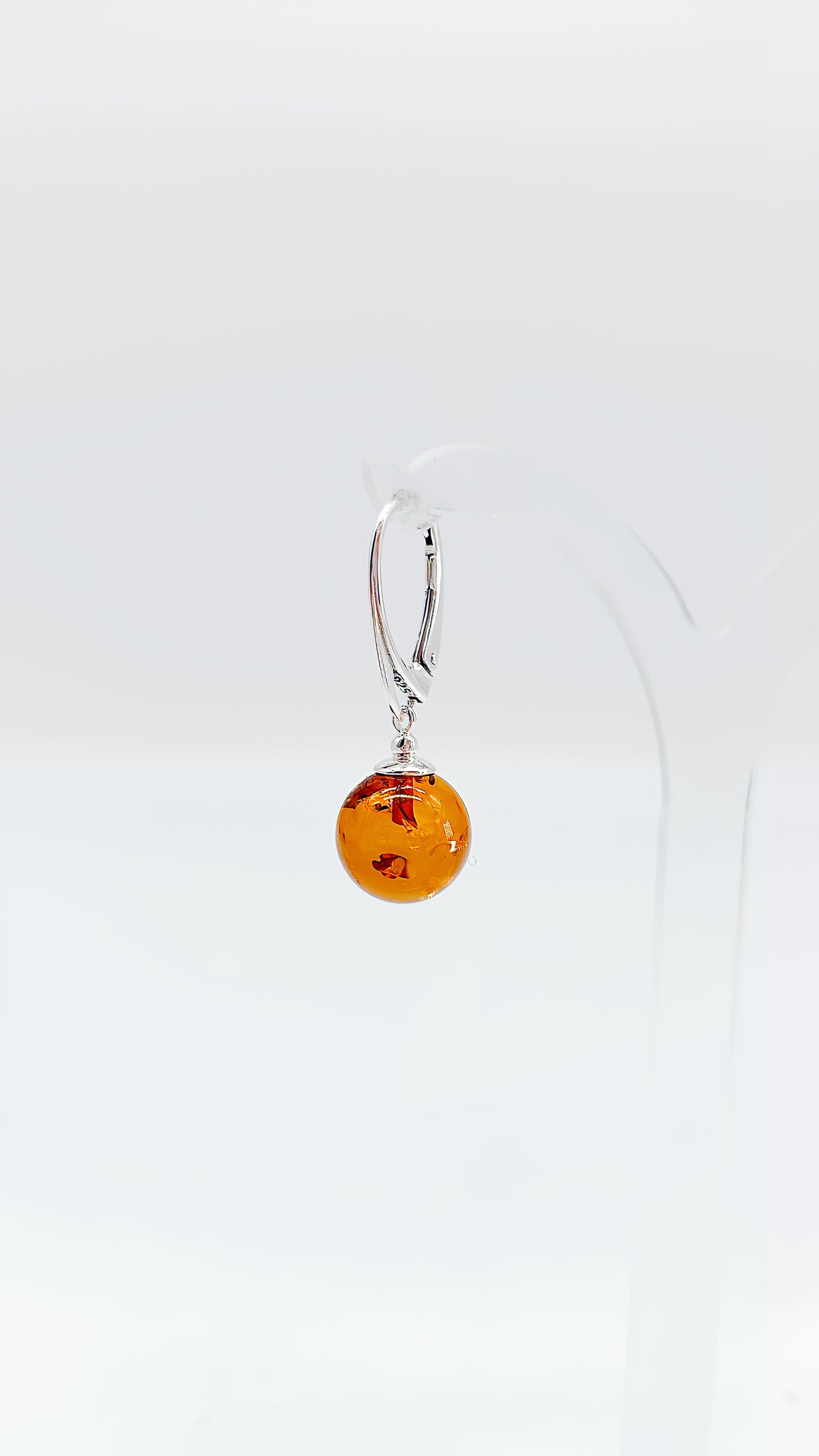 Classic earrings with amber charm