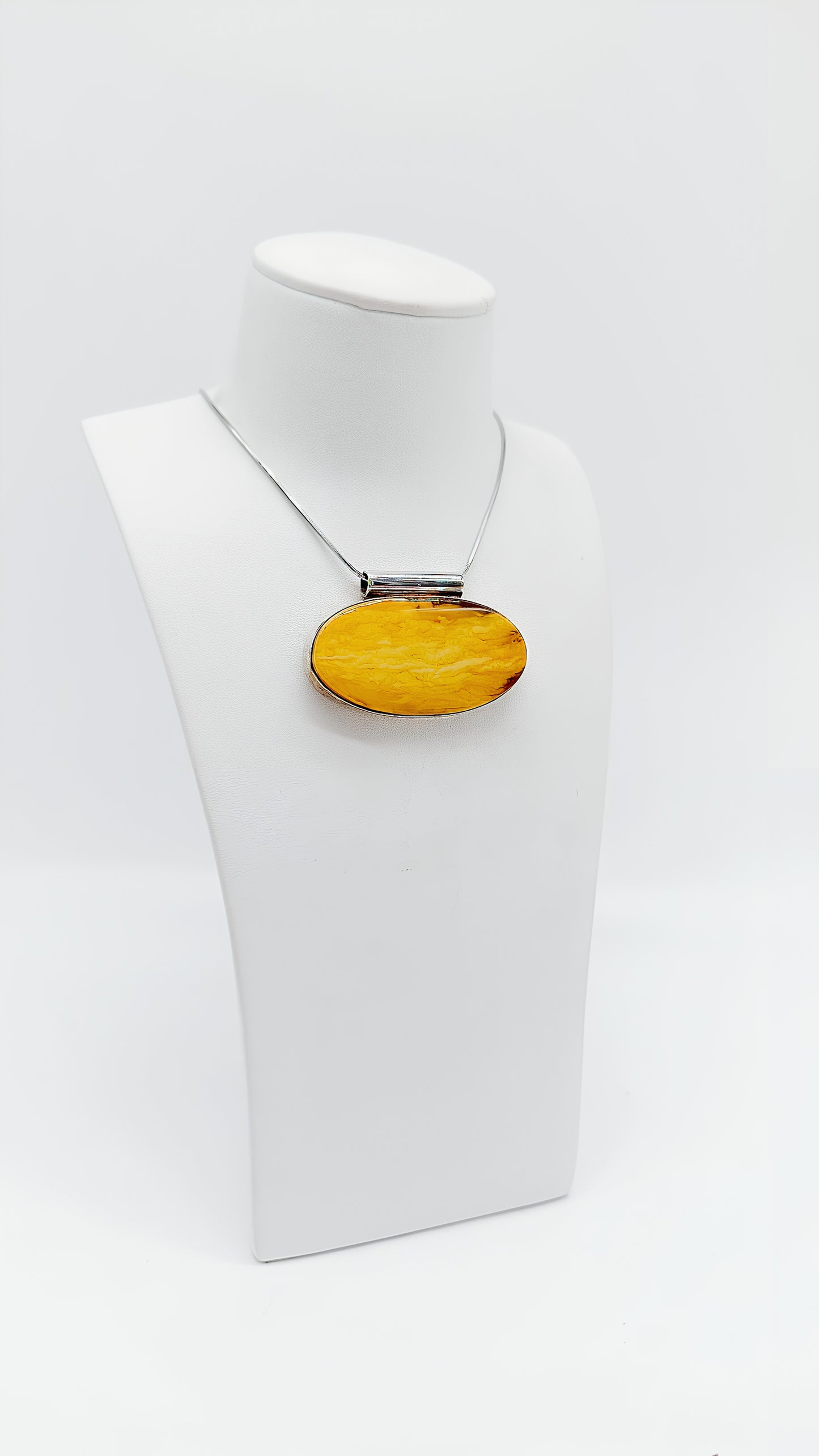 Amber in a noble design: Unique pendant
