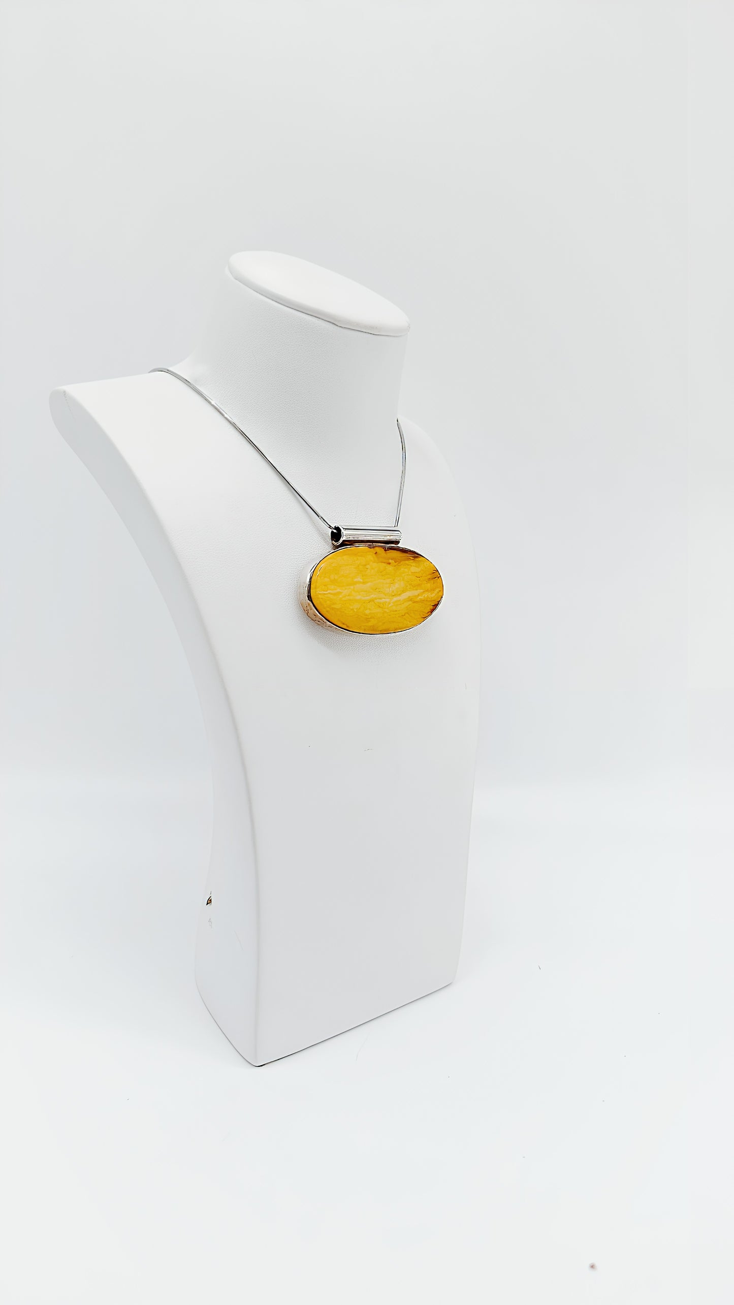 Amber in a noble design: Unique pendant