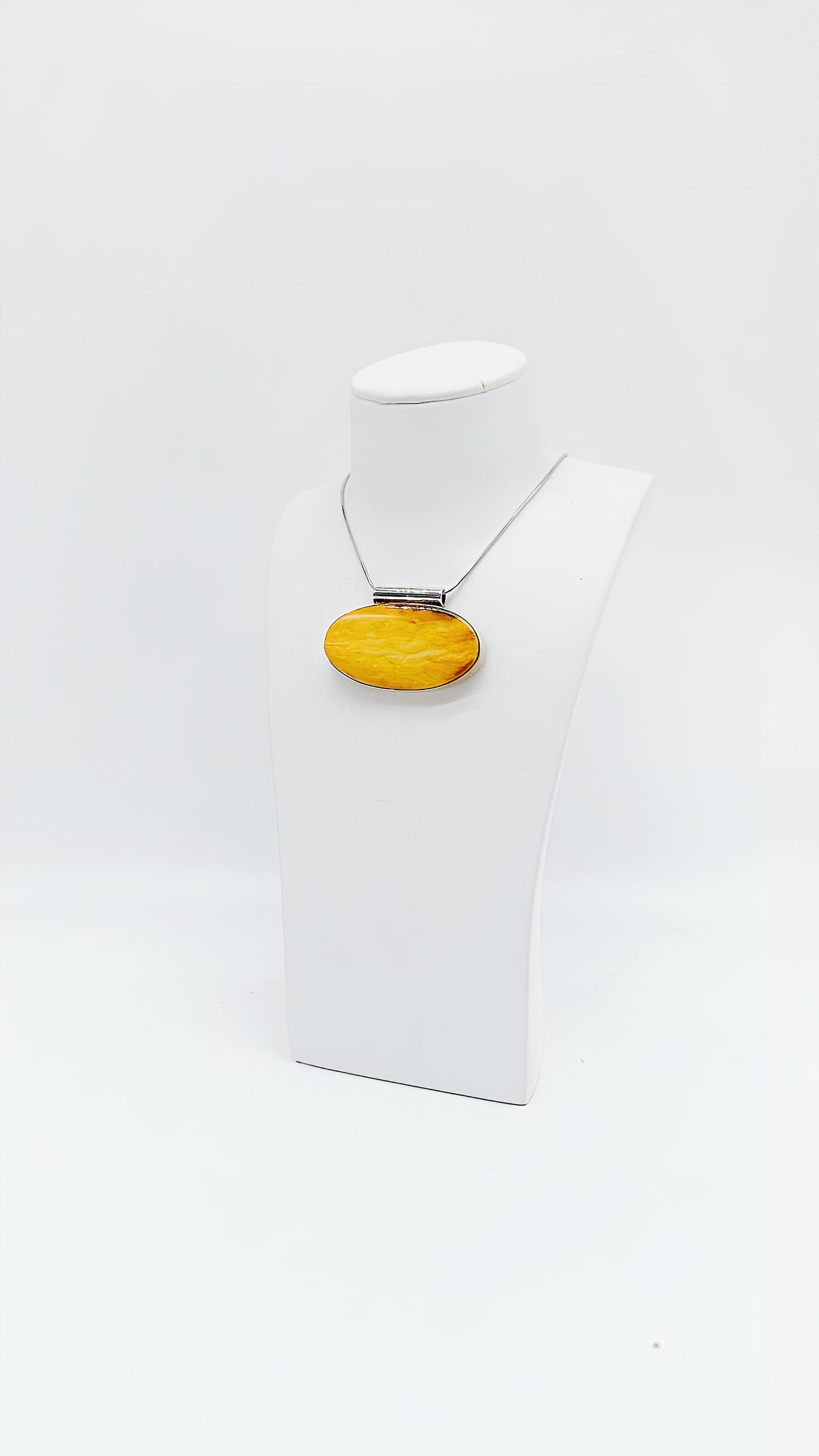 Amber in a noble design: Unique pendant