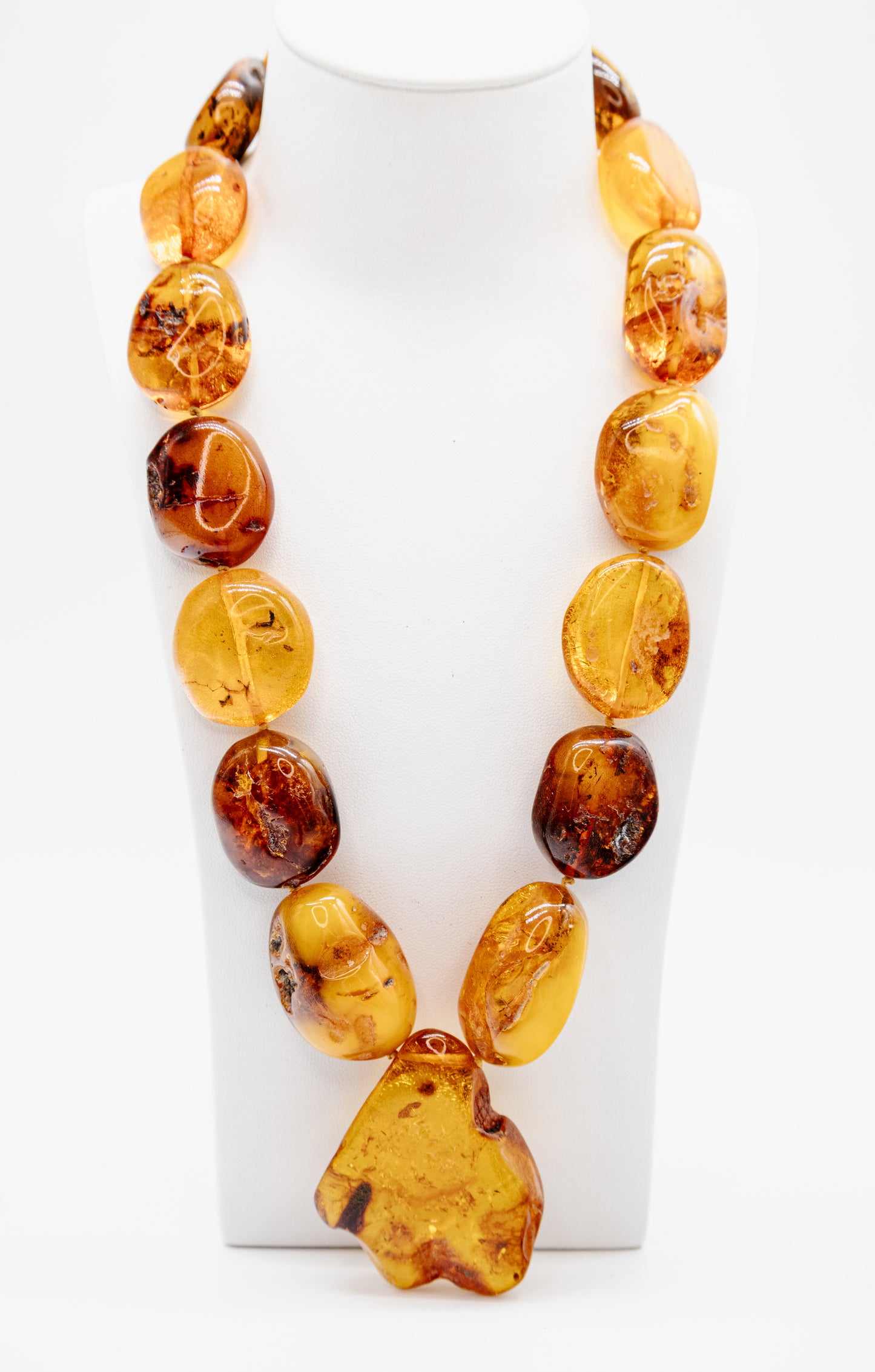 Unique amber necklace with a large center stone