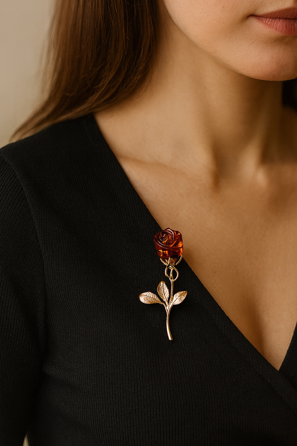 Gold-plated brooch with rose design and amber