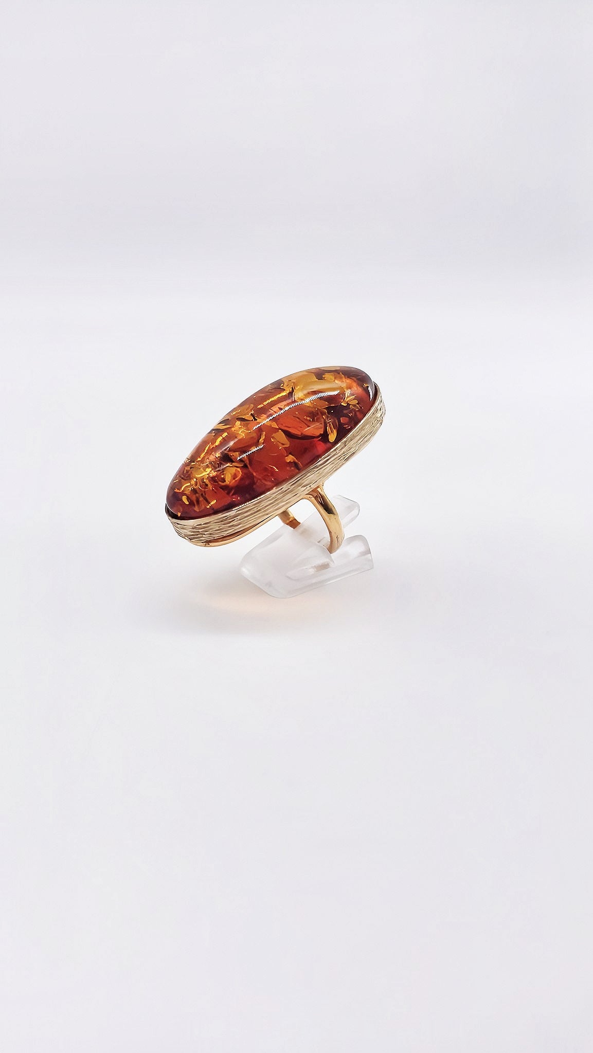 Unique ring: gold-plated silver with bright amber
