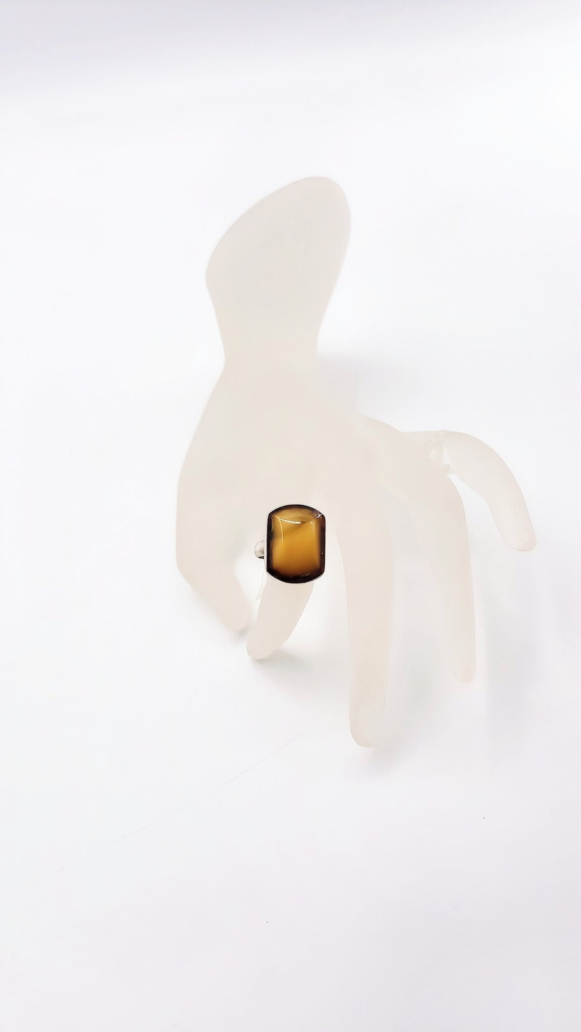 Discreet luxury: amber ring in silver