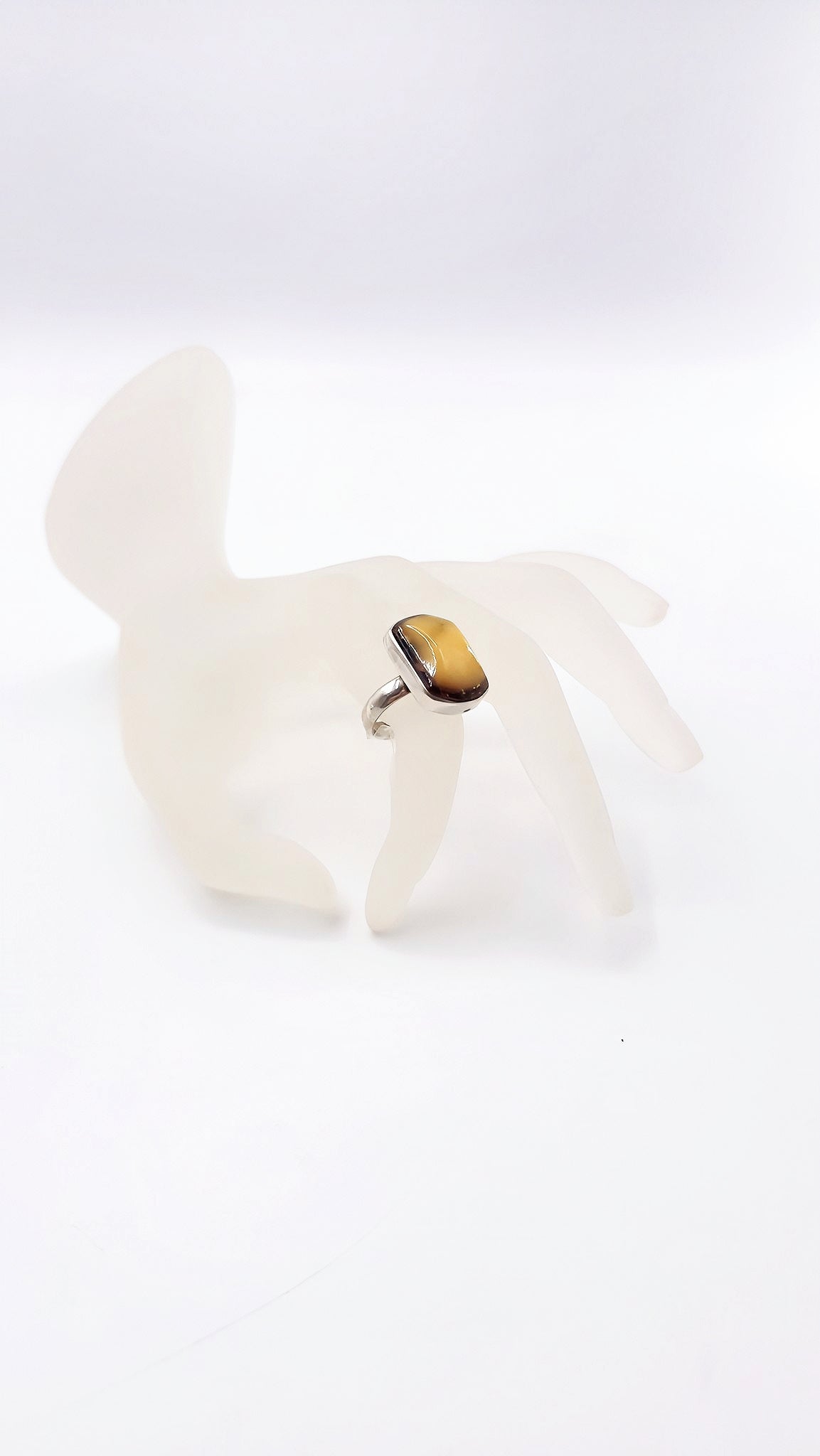 Discreet luxury: amber ring in silver