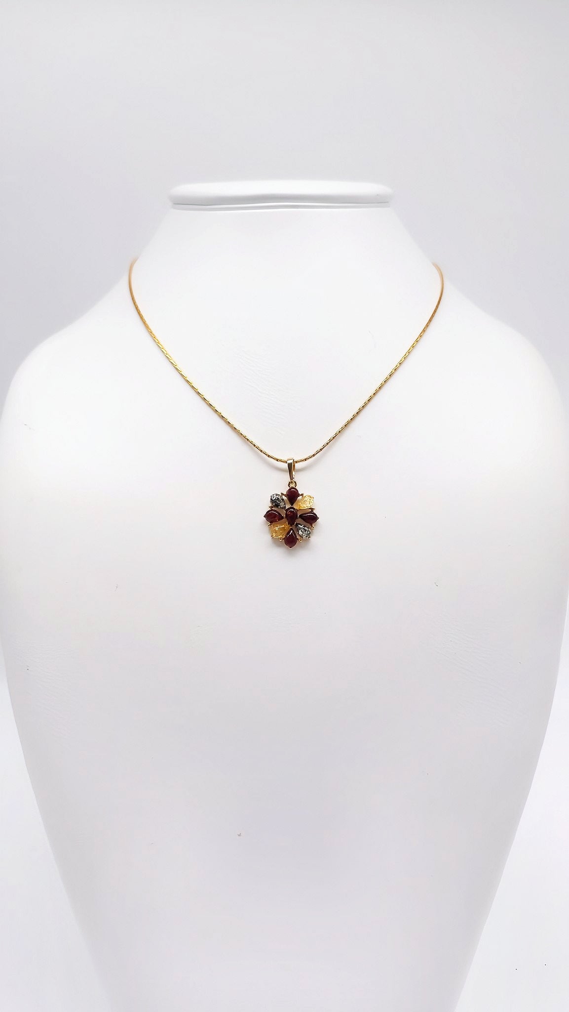 Natural charm: flower pendant with colored amber