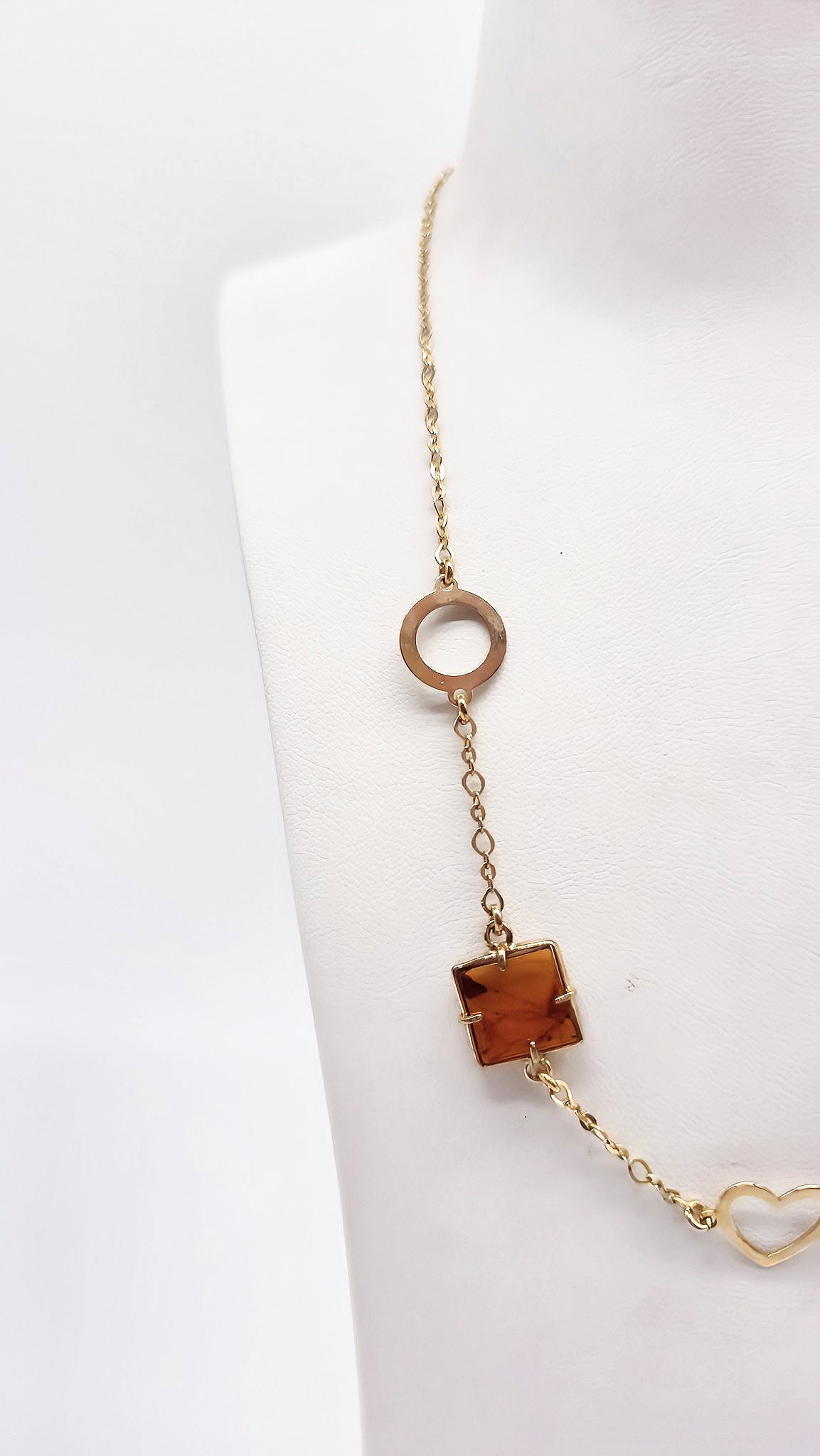 Fijne vergulde ketting met hart, klavertjevier en barnsteen
