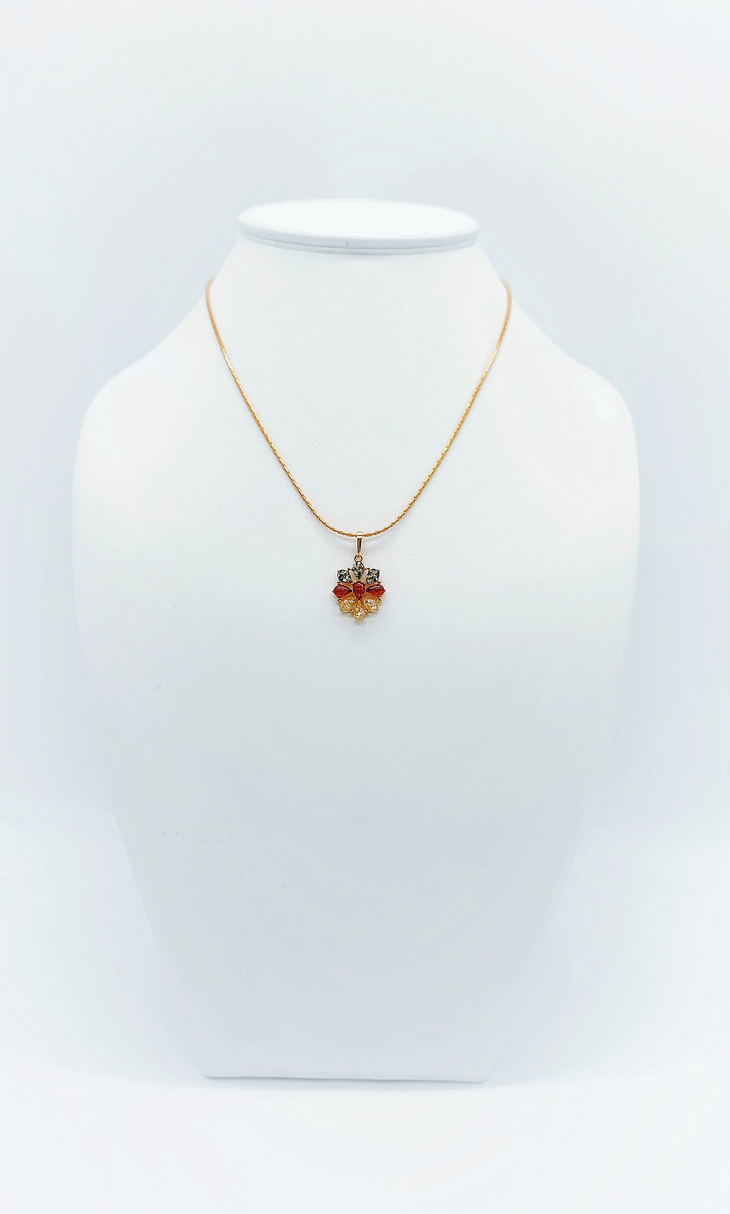 Natural charm: flower pendant with colored amber