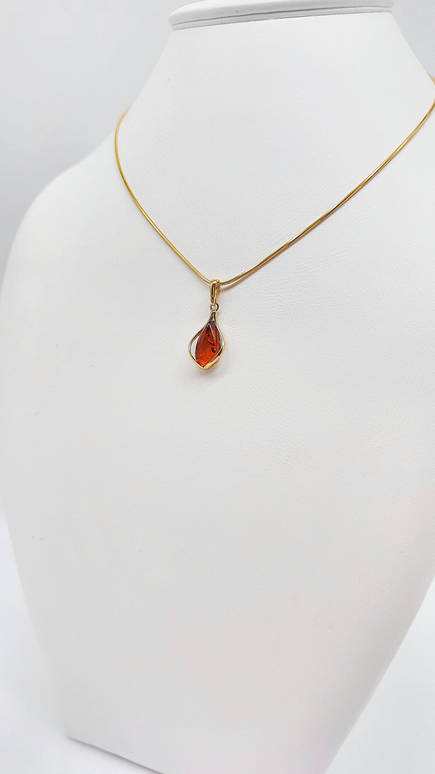 Jewelry set: Gold-plated necklace with genuine amber pendant