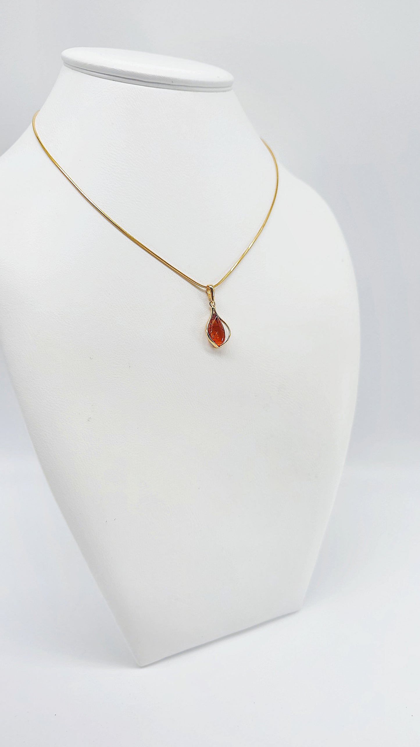 Jewelry set: Gold-plated necklace with genuine amber pendant