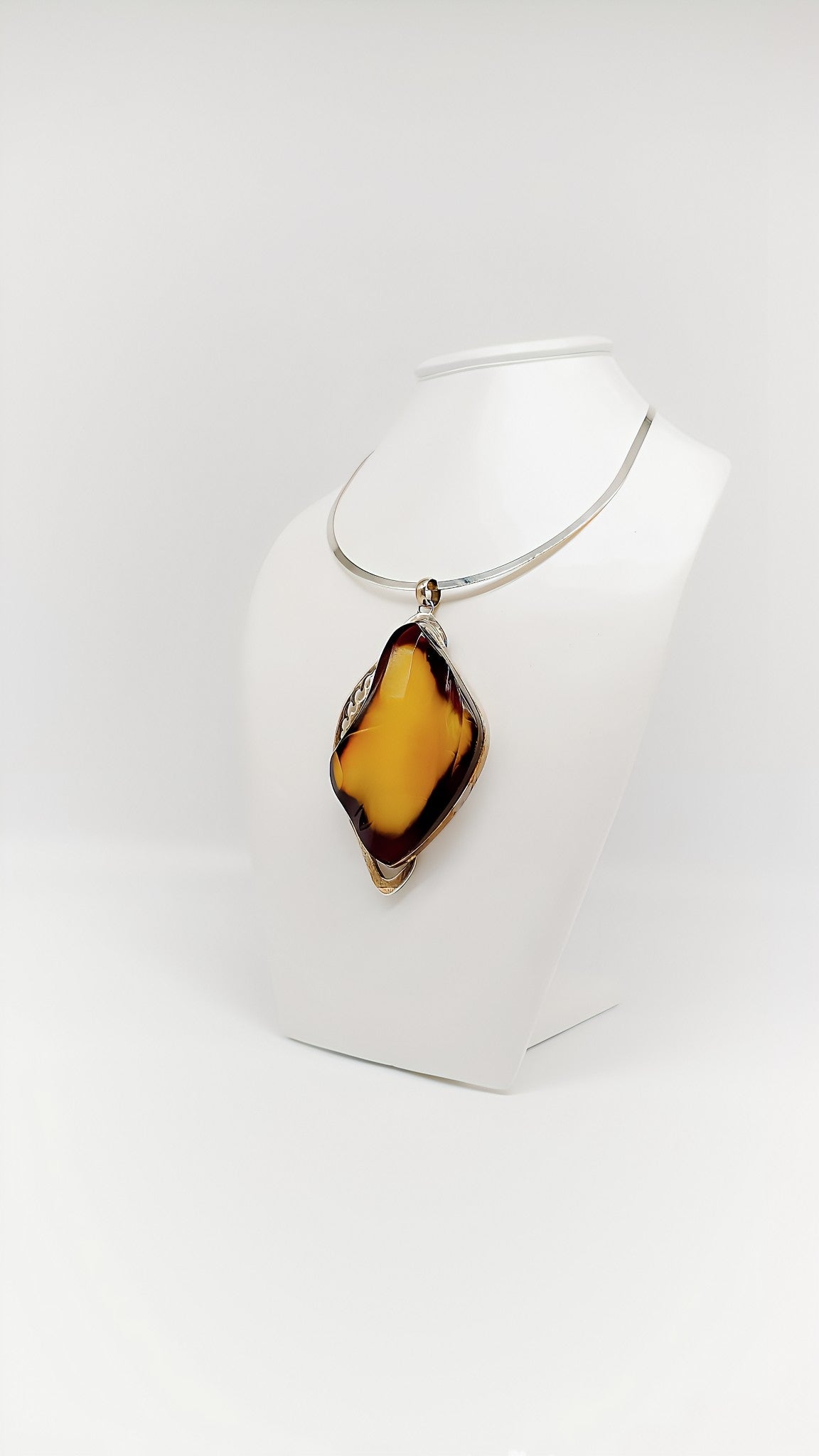 Mystical elegance: unique piece made of amber and silver