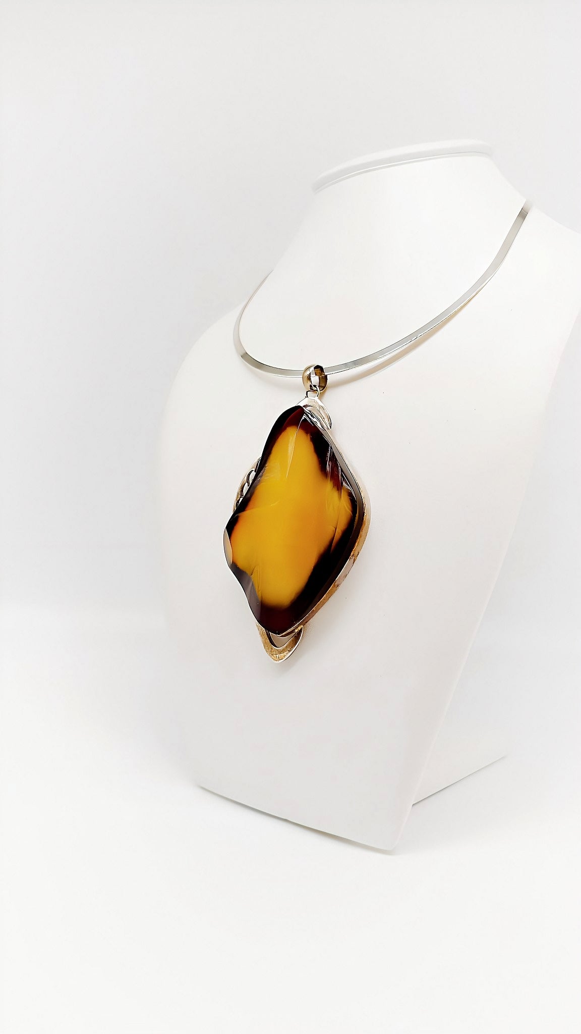 Mystical elegance: unique piece made of amber and silver