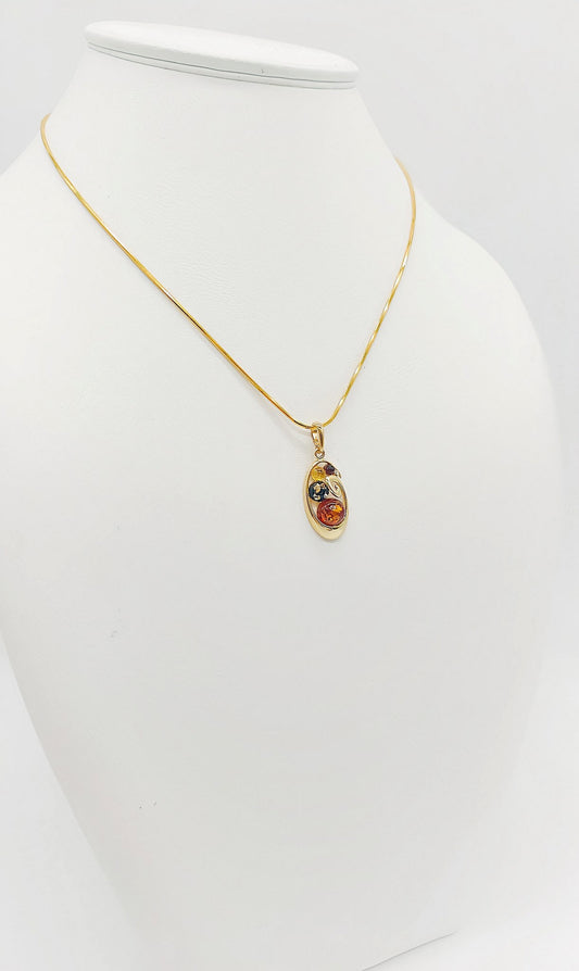 Filigraner Anhänger aus vergoldetem Silber mit Bernstein