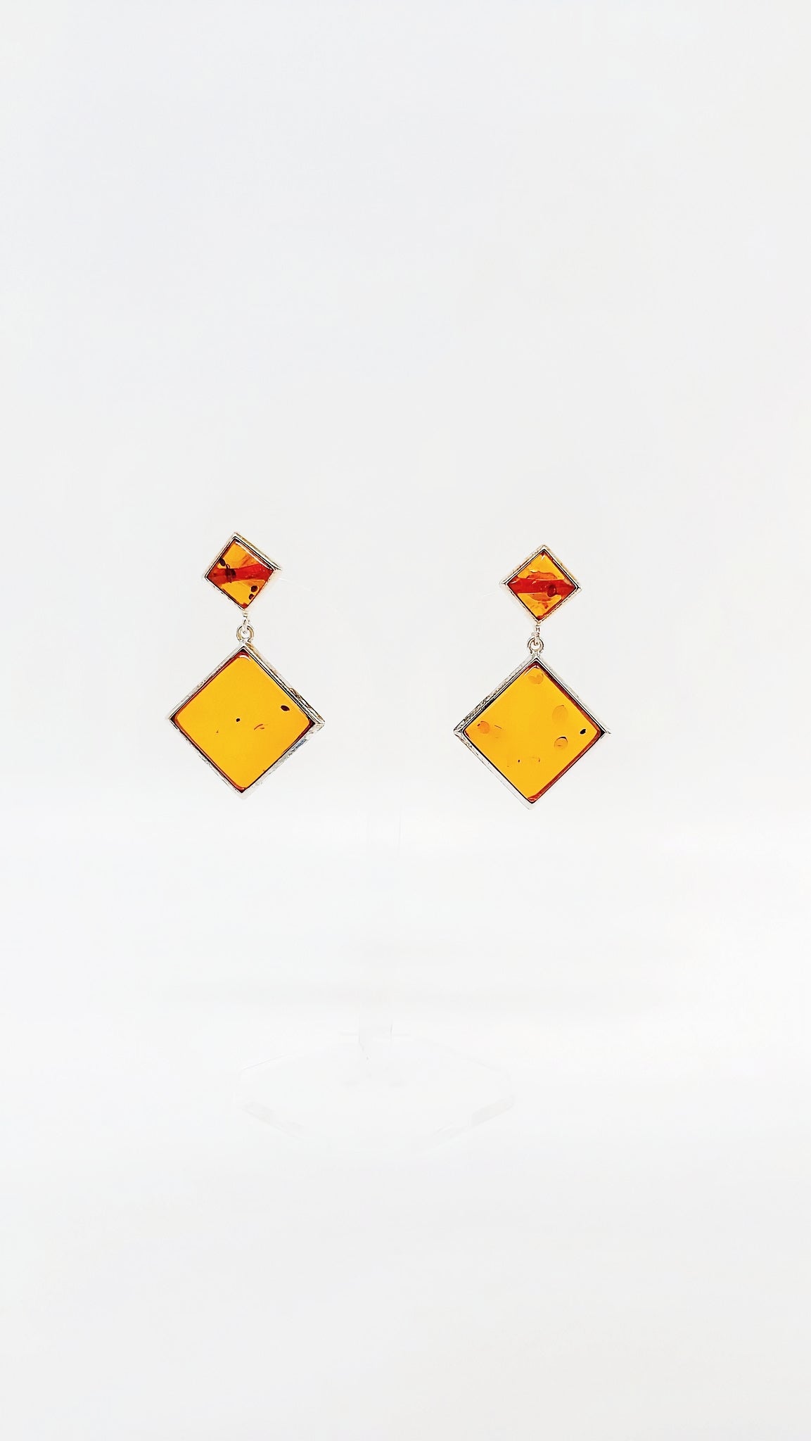 Square amber earrings with silver setting