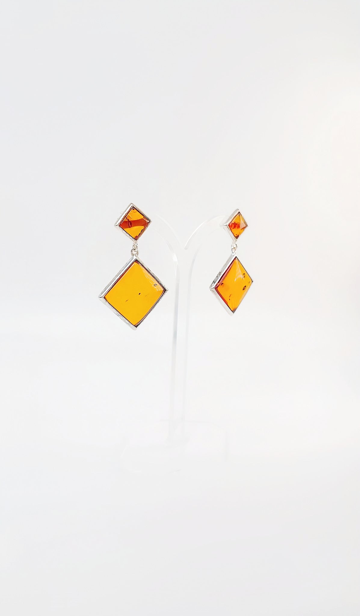Square amber earrings with silver setting