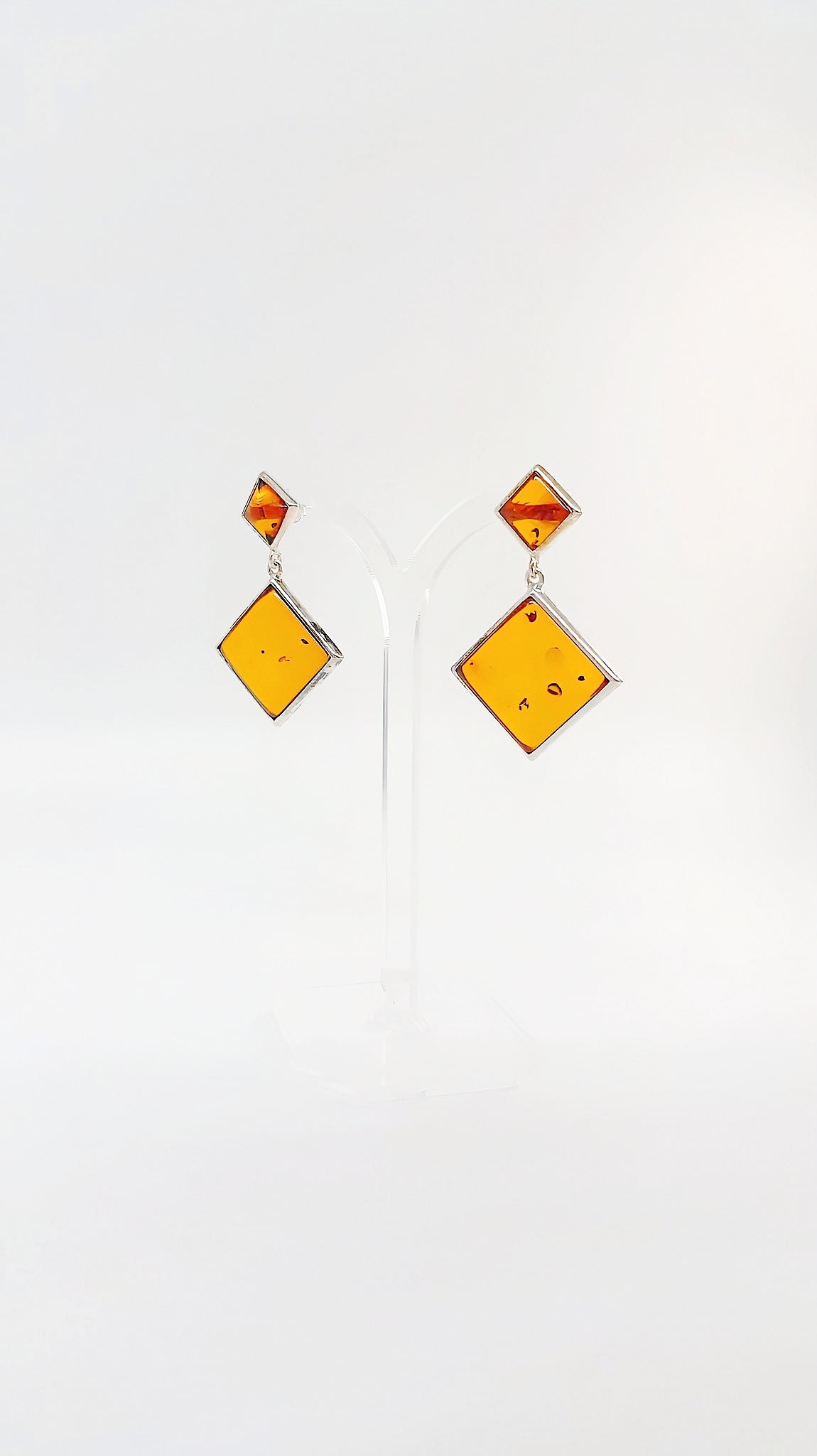 Square amber earrings with silver setting