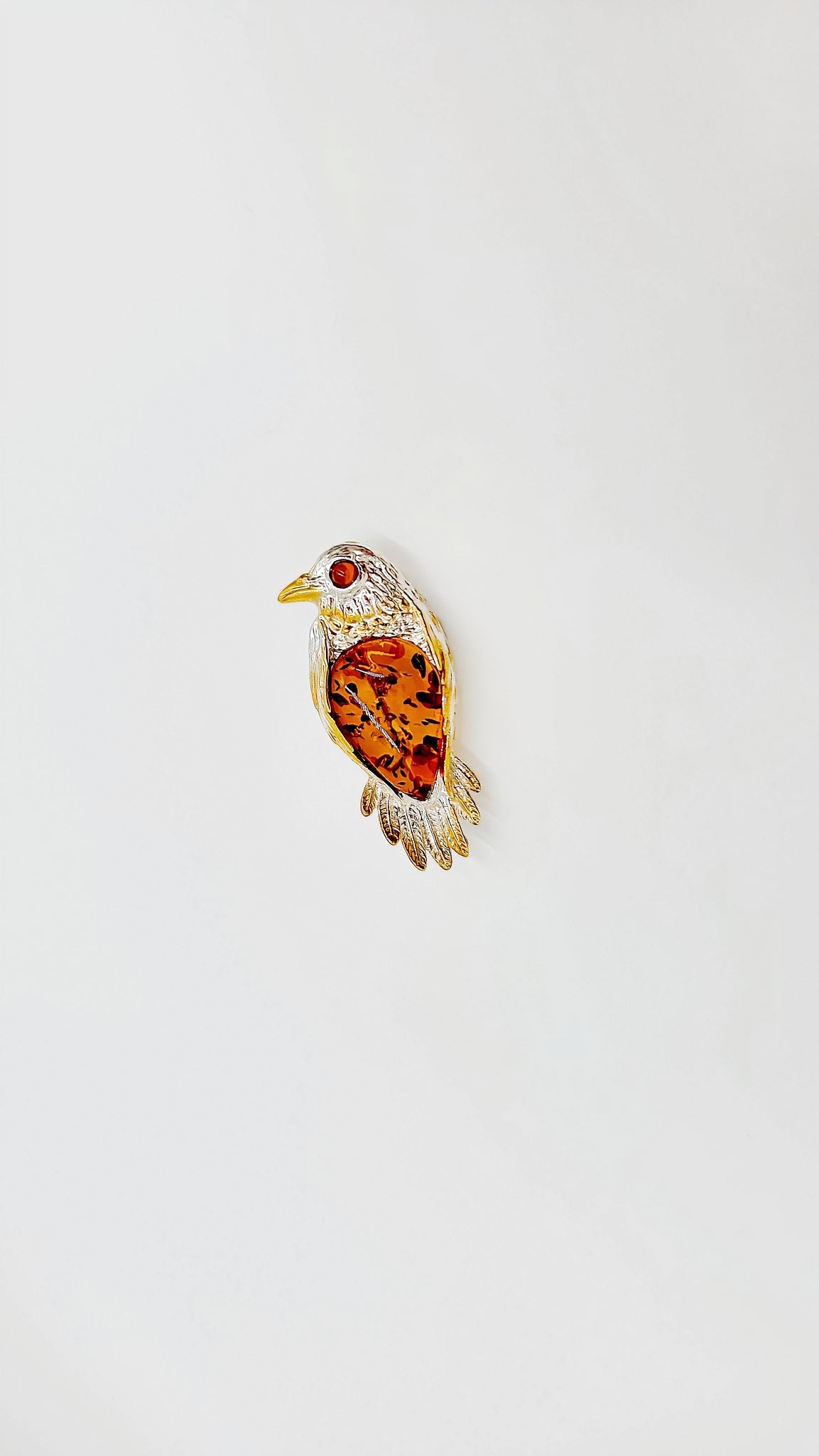 Bernsteinvogel: Naturverbundenheit in Silber und Gold